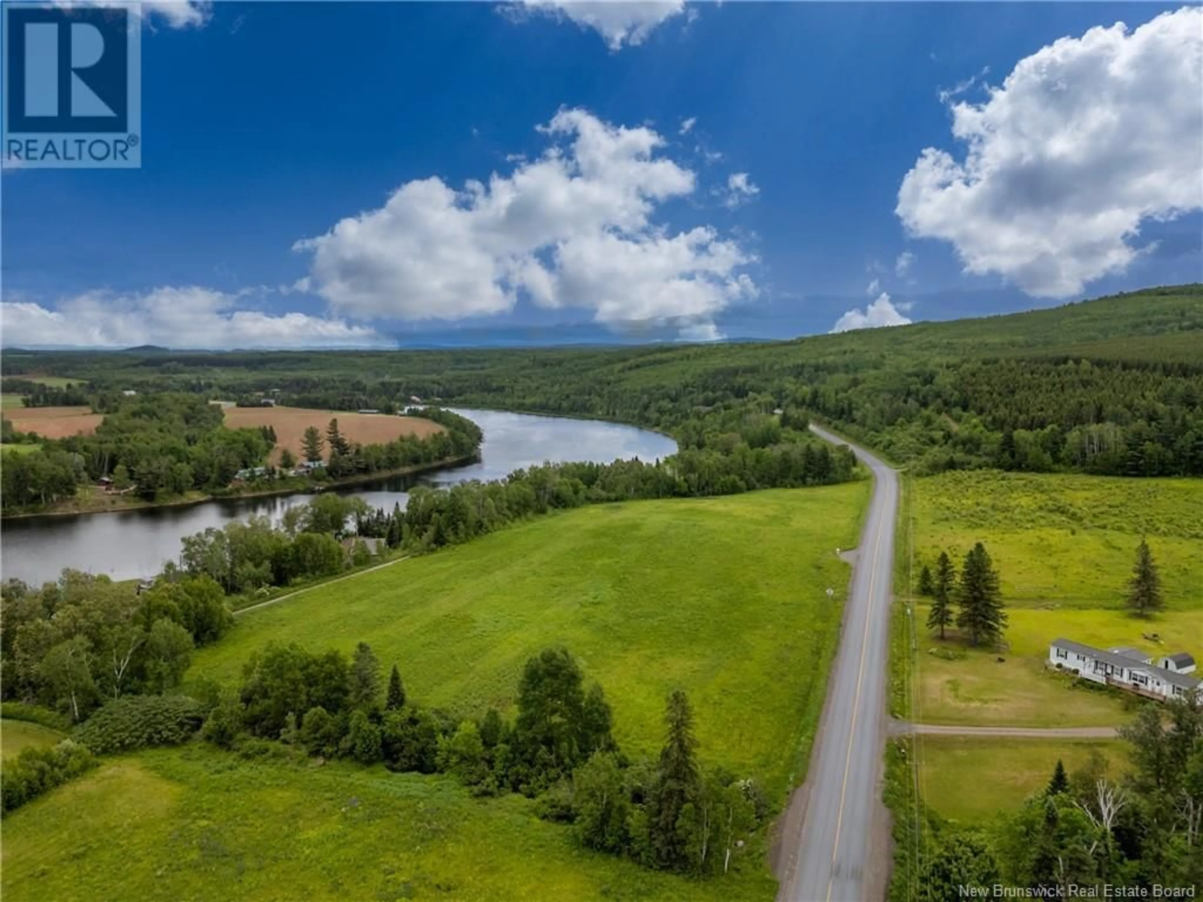 A pic from outside/outdoor area/front of a property/back of a property/a pic from drone, water/lake/river/ocean view for 1190 ROUTE 109, Red Rapids New Brunswick E7H4H3