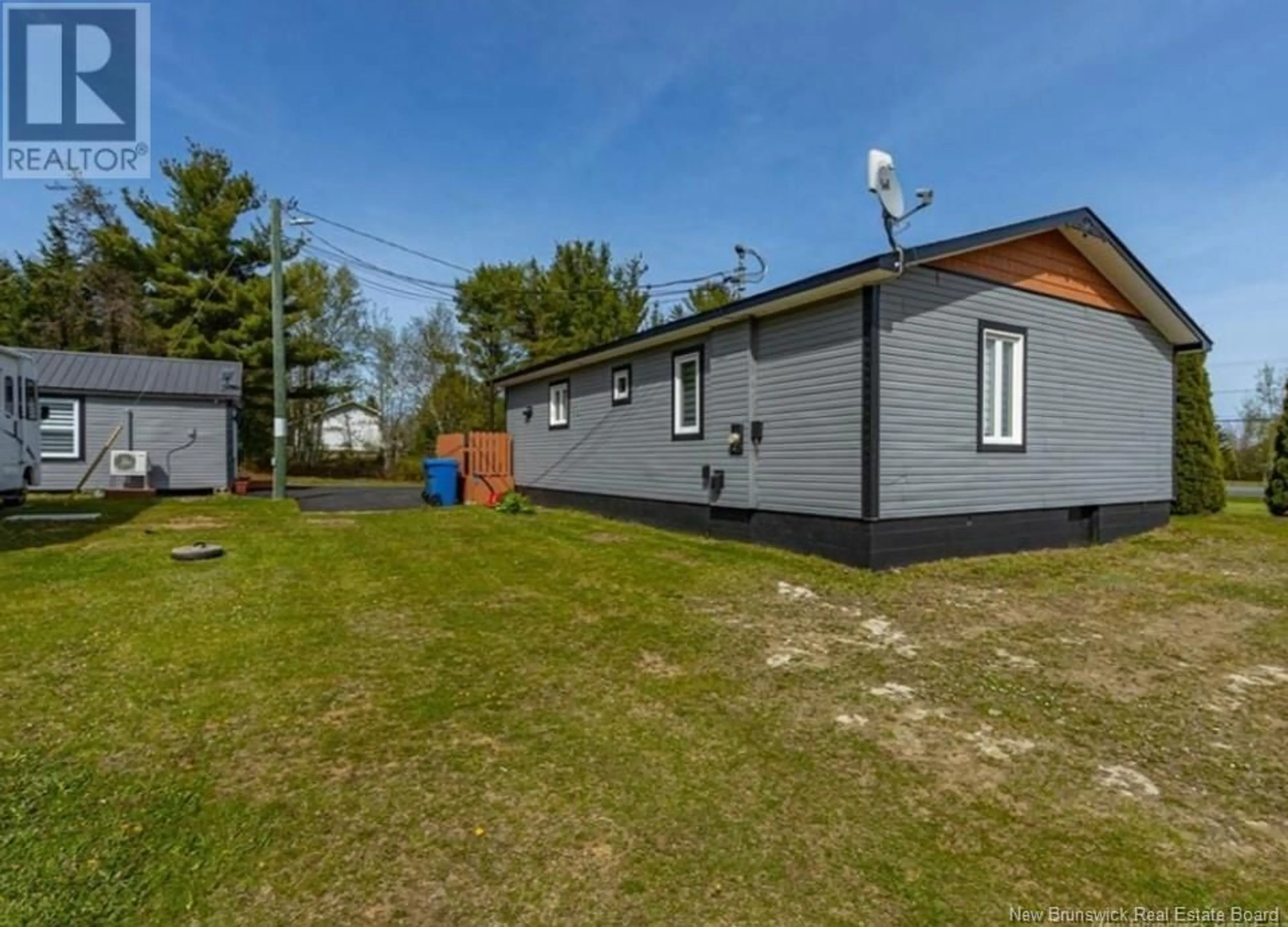A pic from outside/outdoor area/front of a property/back of a property/a pic from drone, street for 4915 ROUTE 11, Brantville New Brunswick E9H1M3