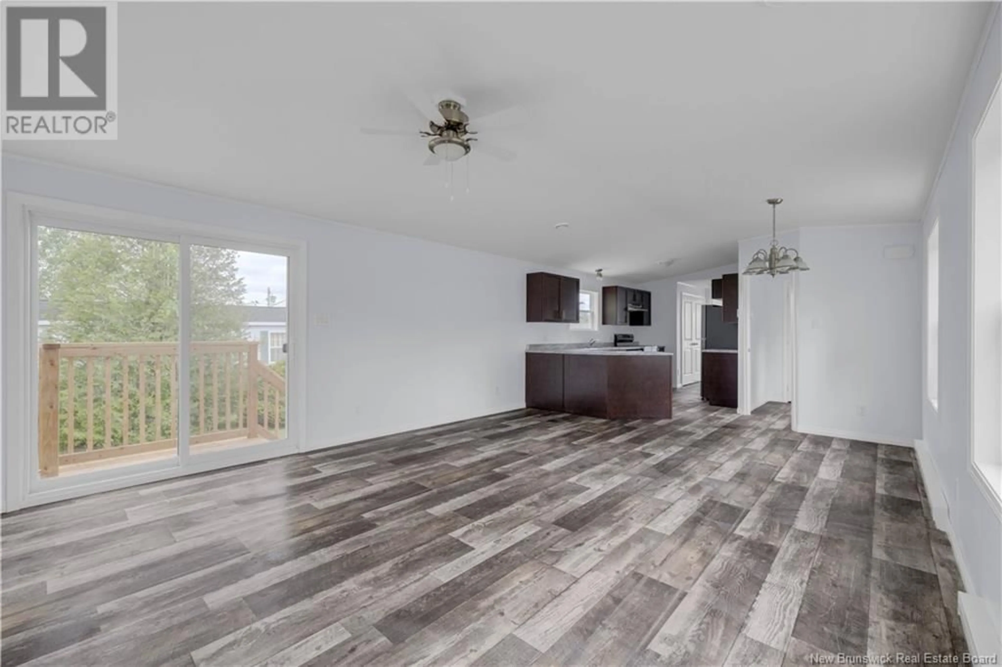 Open concept kitchen, wood/laminate floor for 22 DARRELL AVENUE, Quispamsis New Brunswick E2G1T1