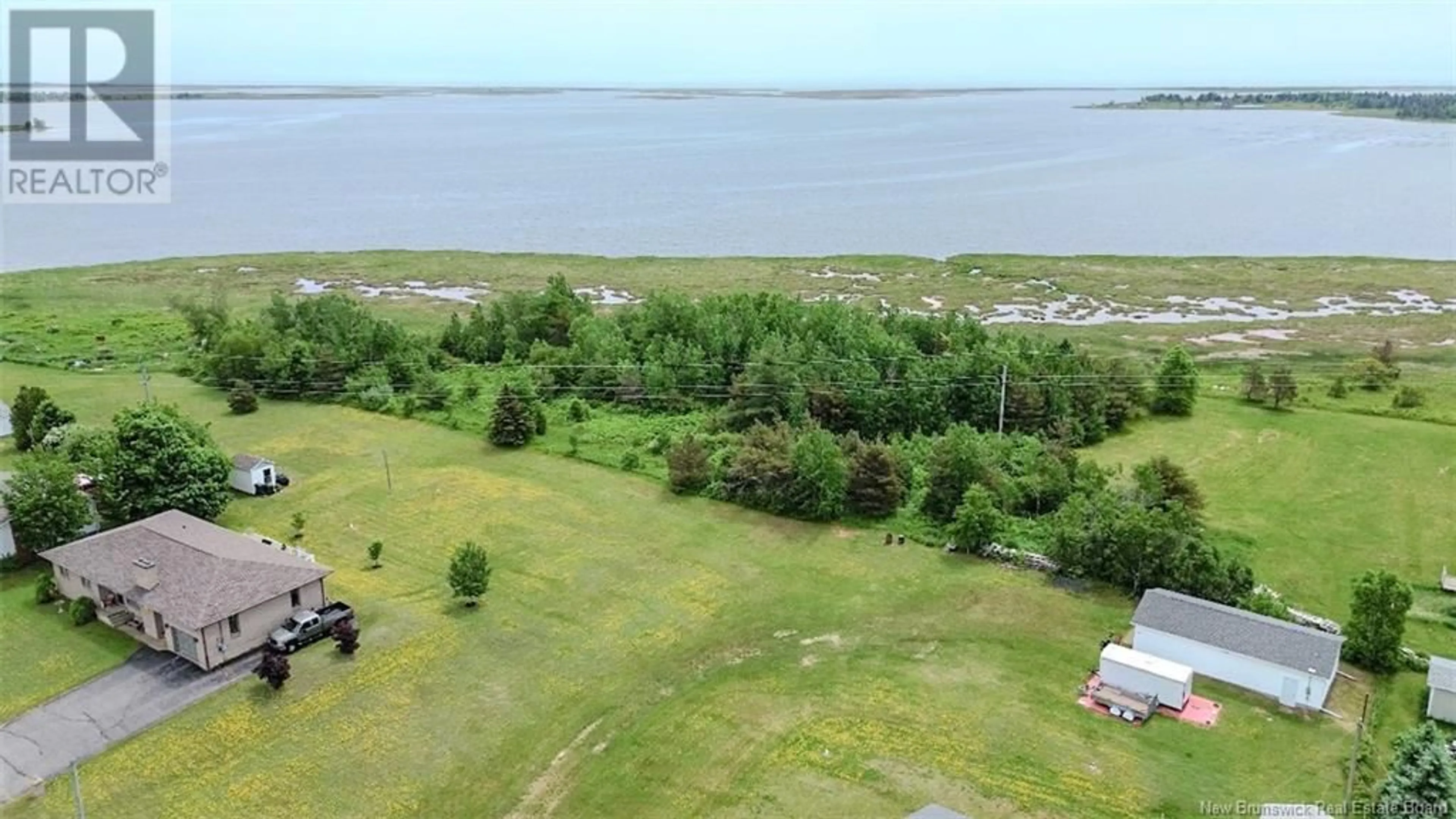 A pic from outside/outdoor area/front of a property/back of a property/a pic from drone, water/lake/river/ocean view for 971 ROUTE 113, Inkerman New Brunswick E8P1E7