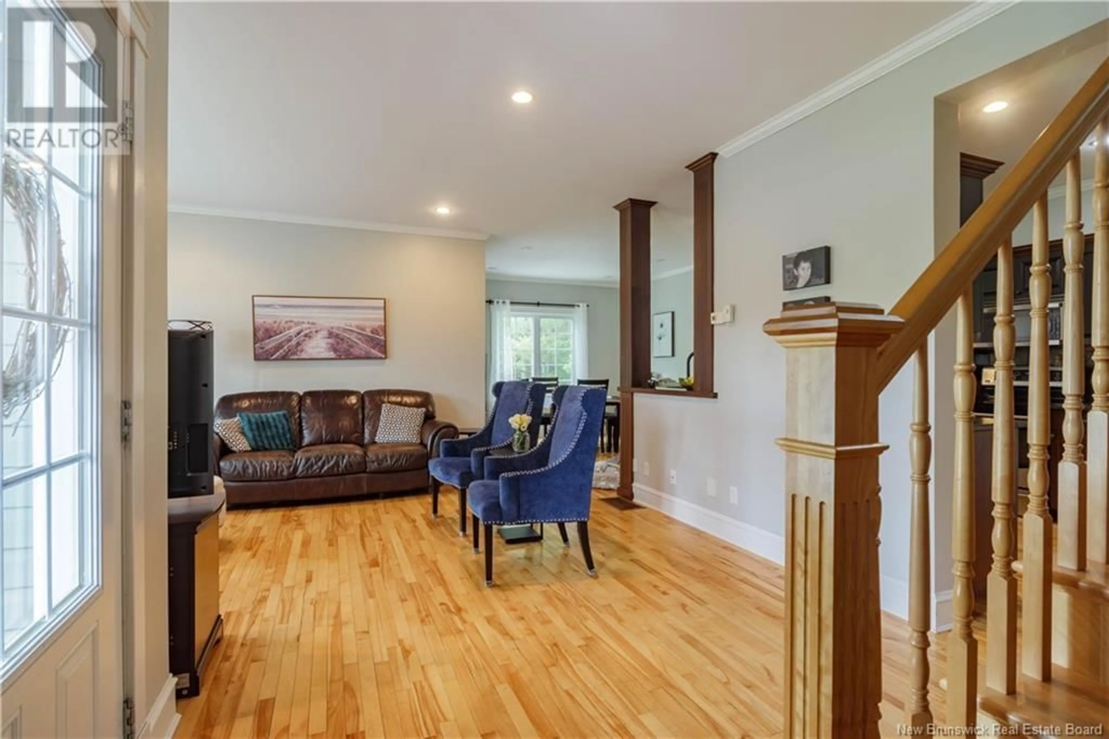 Living room with furniture, wood/laminate floor for 43 SANDSTONE DRIVE, Hanwell New Brunswick E3E2R2