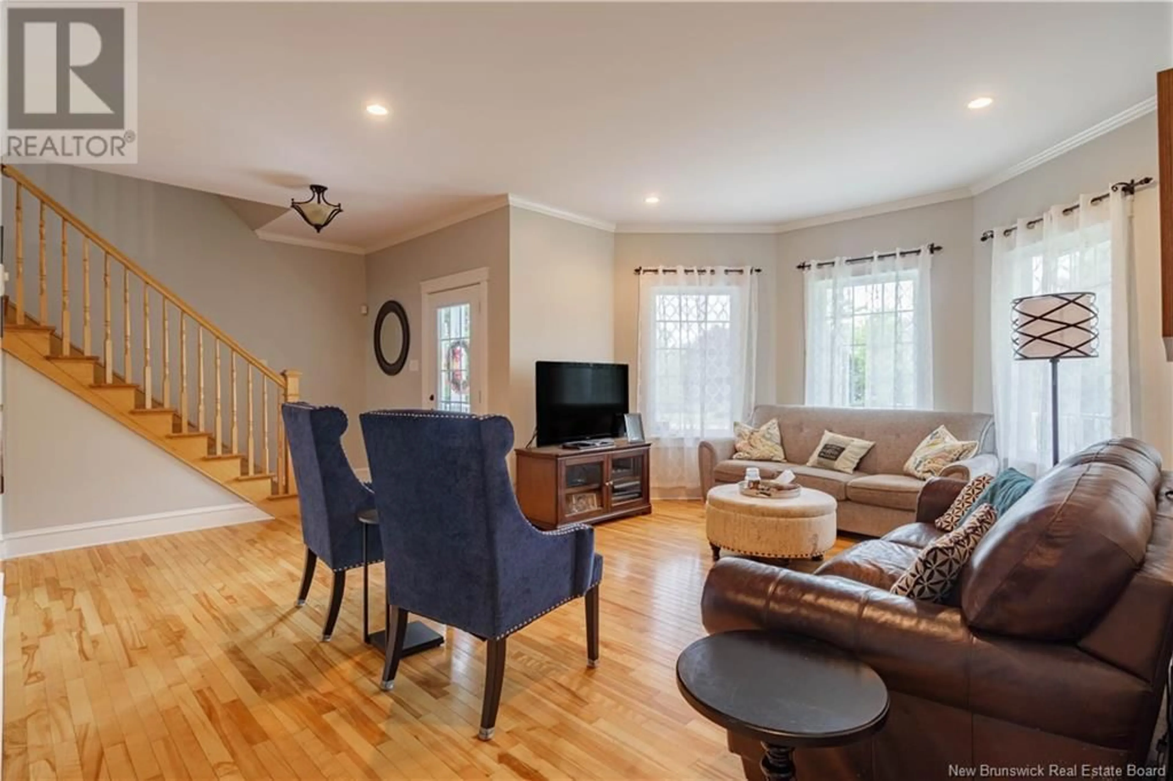 Living room with furniture, wood/laminate floor for 43 SANDSTONE DRIVE, Hanwell New Brunswick E3E2R2