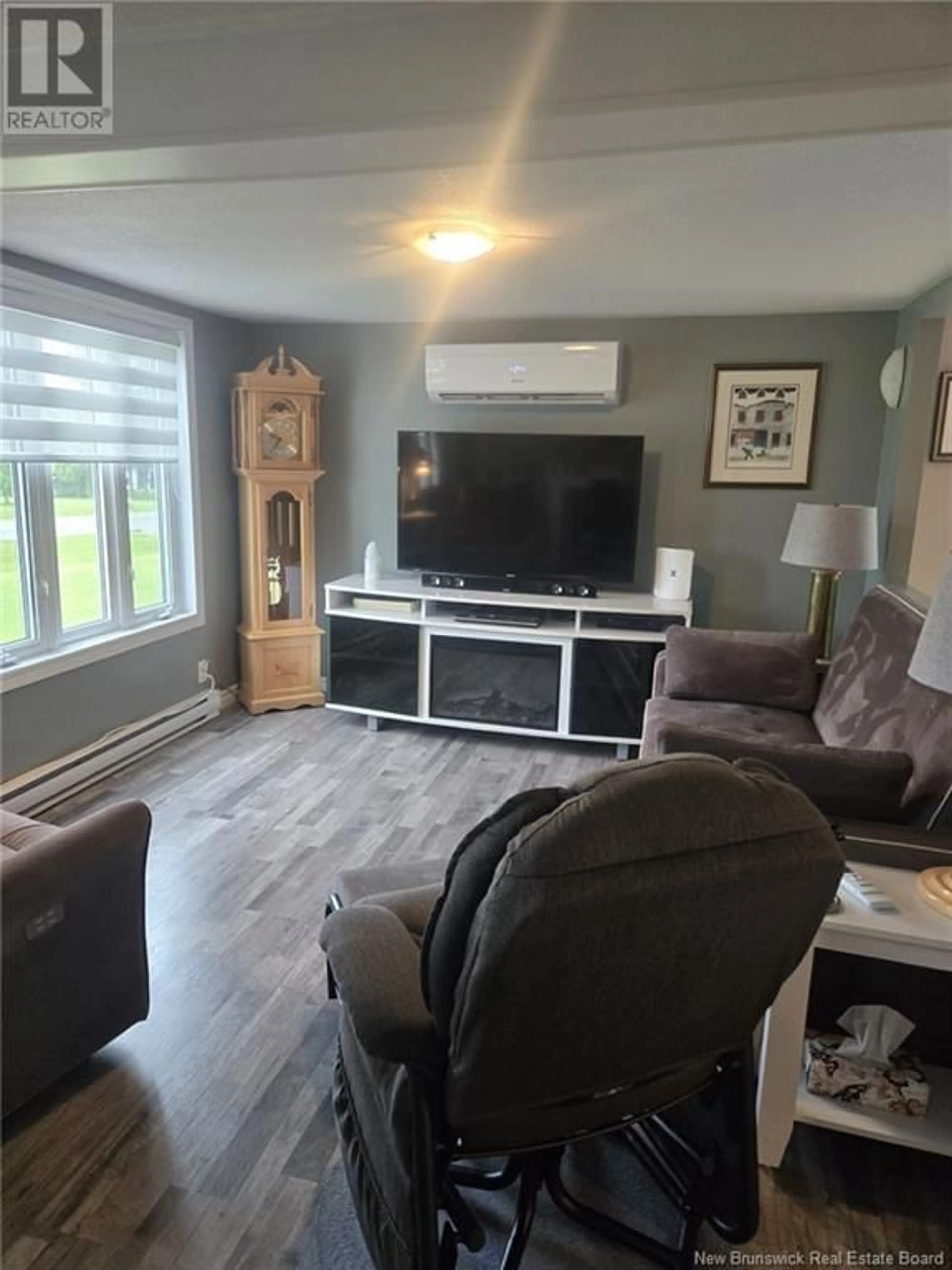 Living room with furniture, wood/laminate floor for 18 SAINT-FRANCOIS STREET, Sainte-Anne-De-Madawaska New Brunswick E7E1E4