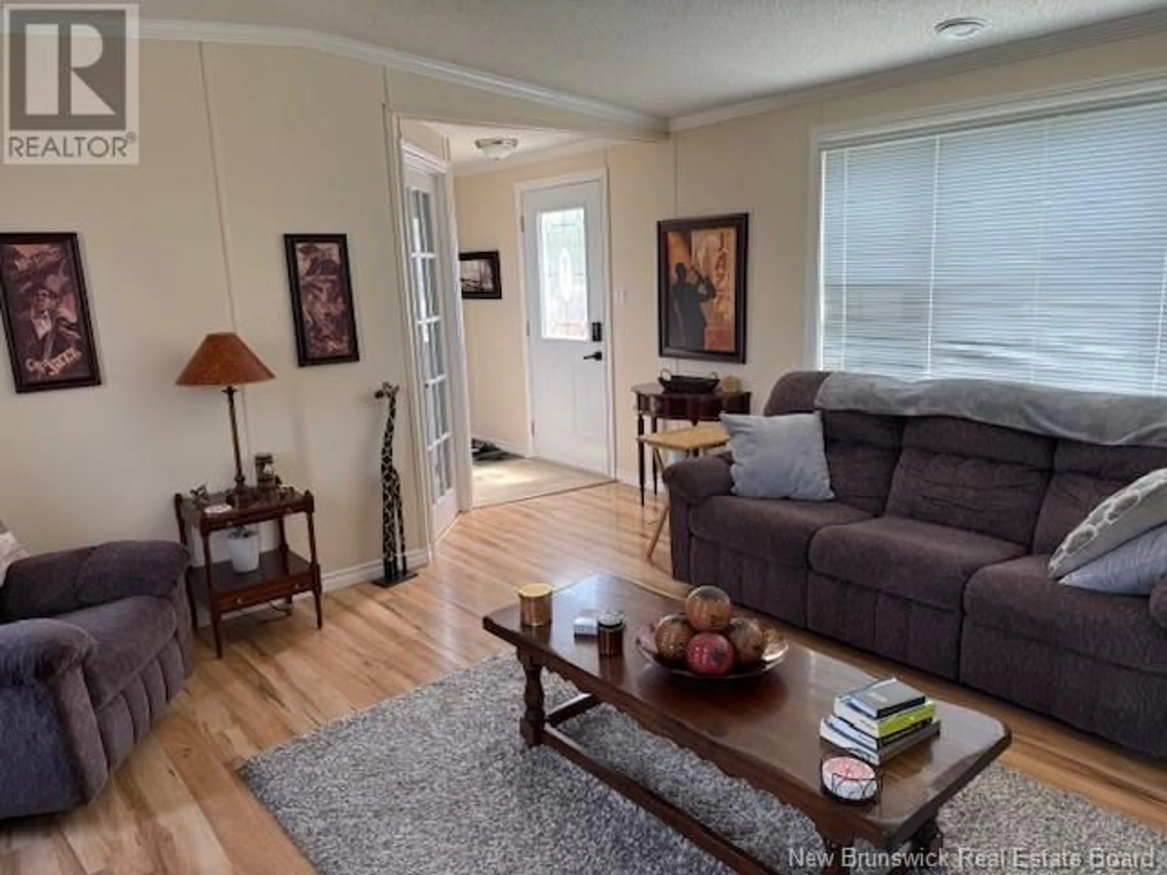 Living room with furniture, wood/laminate floor for 91 HAYWARD LANE, Riverview New Brunswick E1B0G3