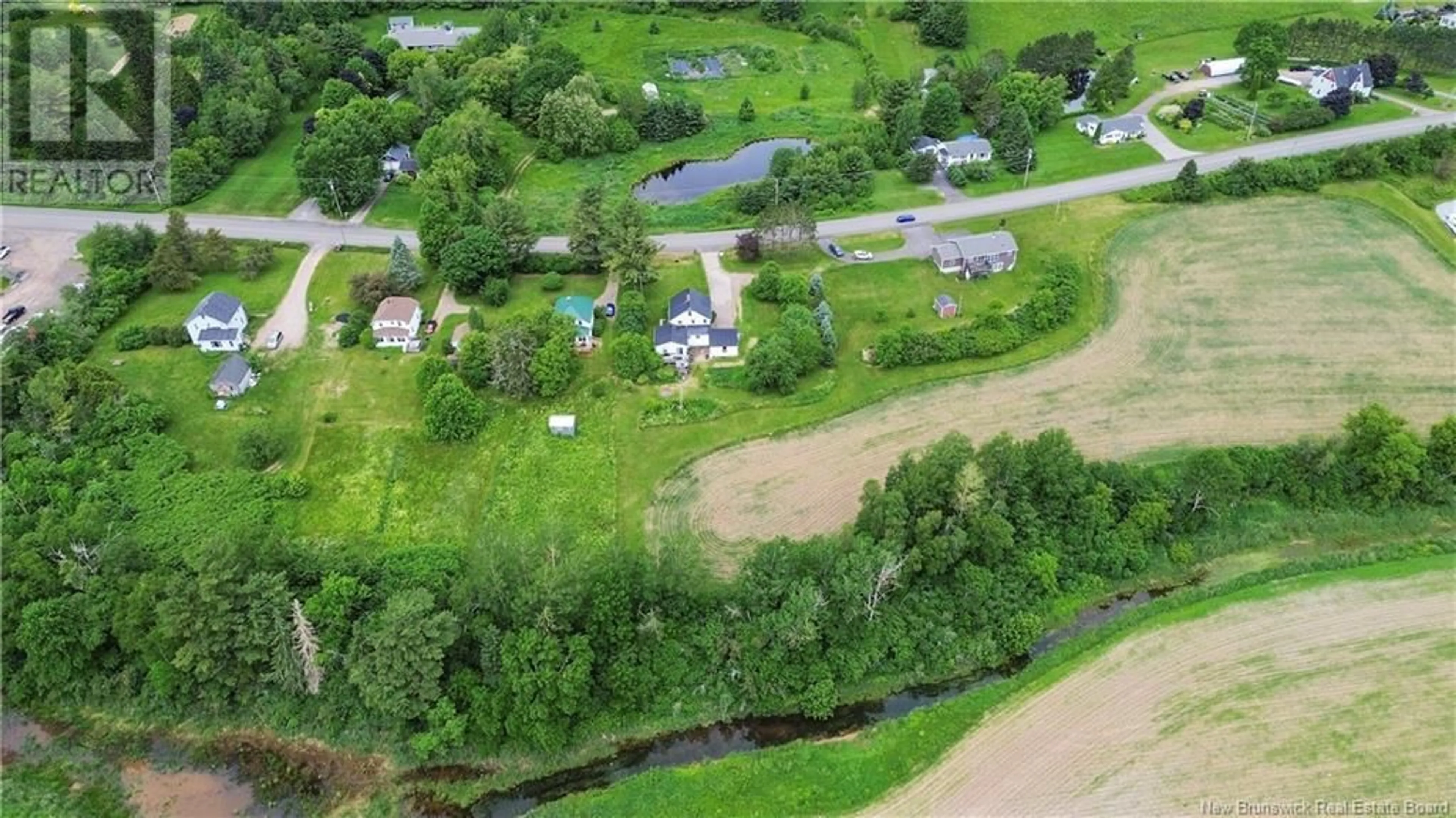 A pic from outside/outdoor area/front of a property/back of a property/a pic from drone, water/lake/river/ocean view for 3314 ROUTE 121 ROUTE, Apohaqui New Brunswick E5P1B1