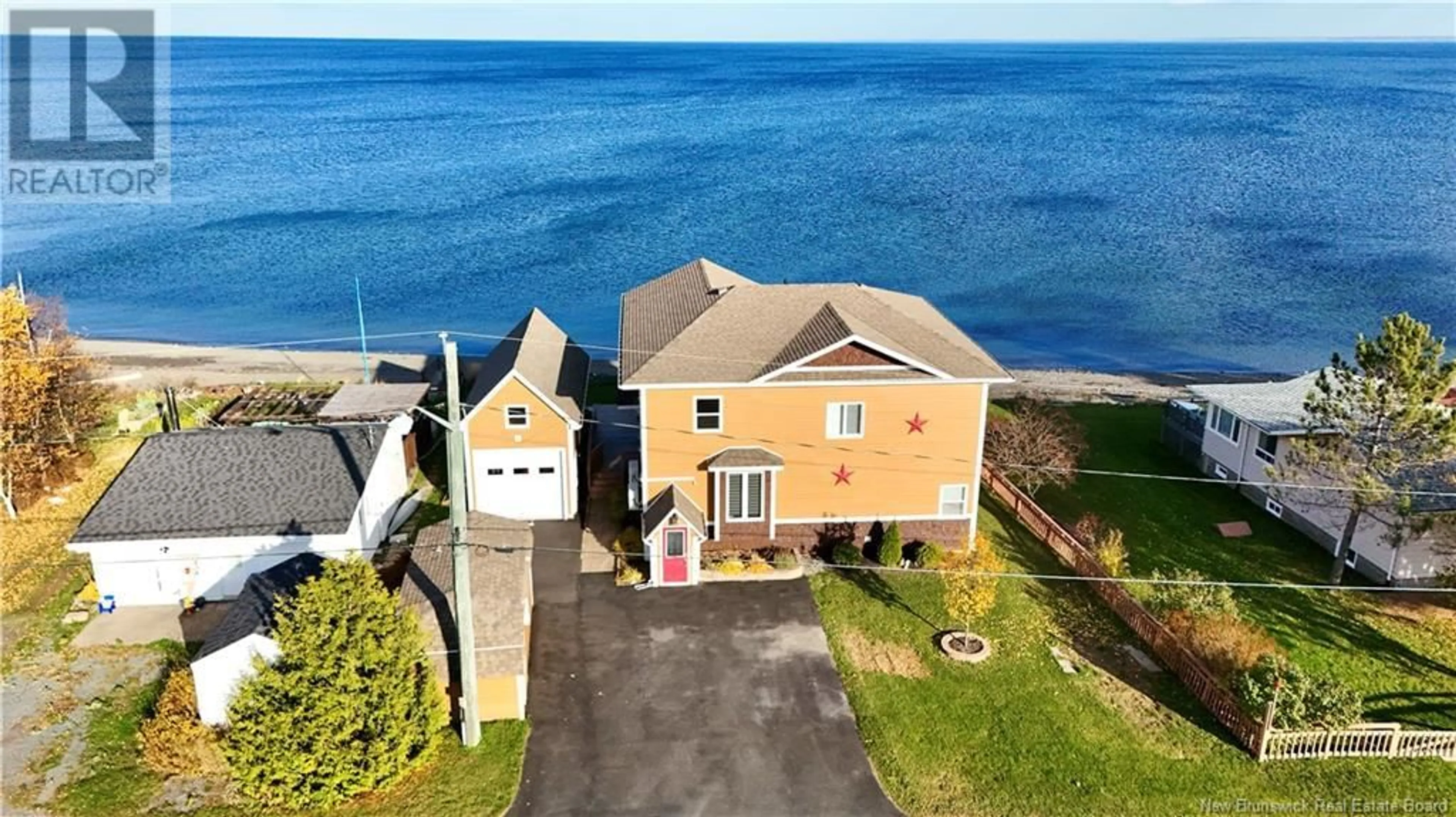 A pic from outside/outdoor area/front of a property/back of a property/a pic from drone, water/lake/river/ocean view for 519 BEL AIR, Beresford New Brunswick E8K1X8