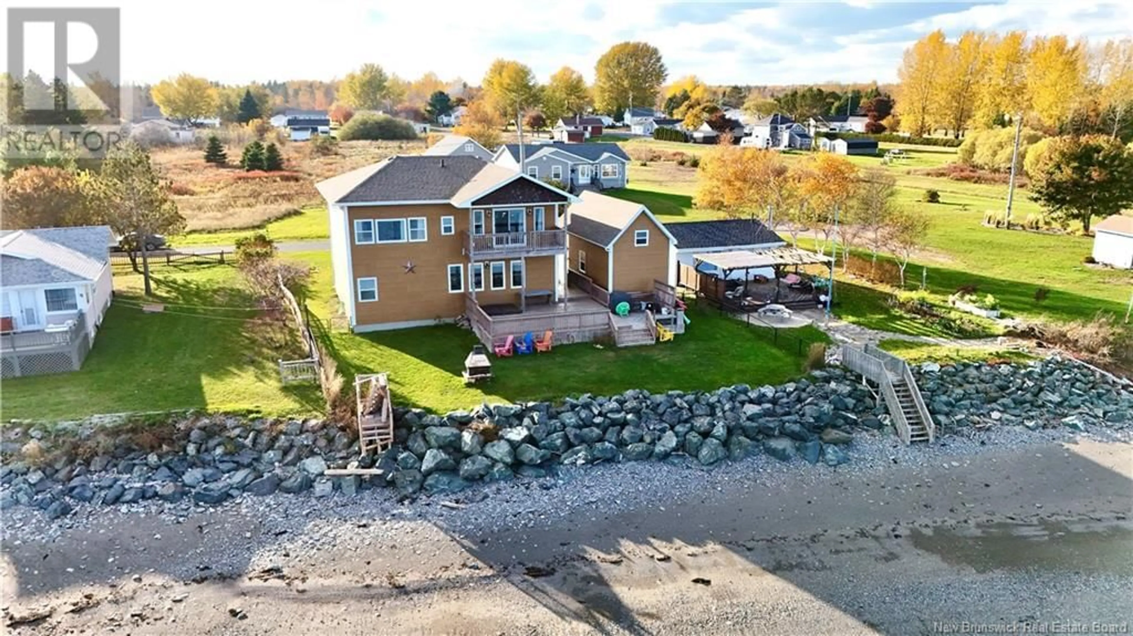 A pic from outside/outdoor area/front of a property/back of a property/a pic from drone, water/lake/river/ocean view for 519 BEL AIR, Beresford New Brunswick E8K1X8