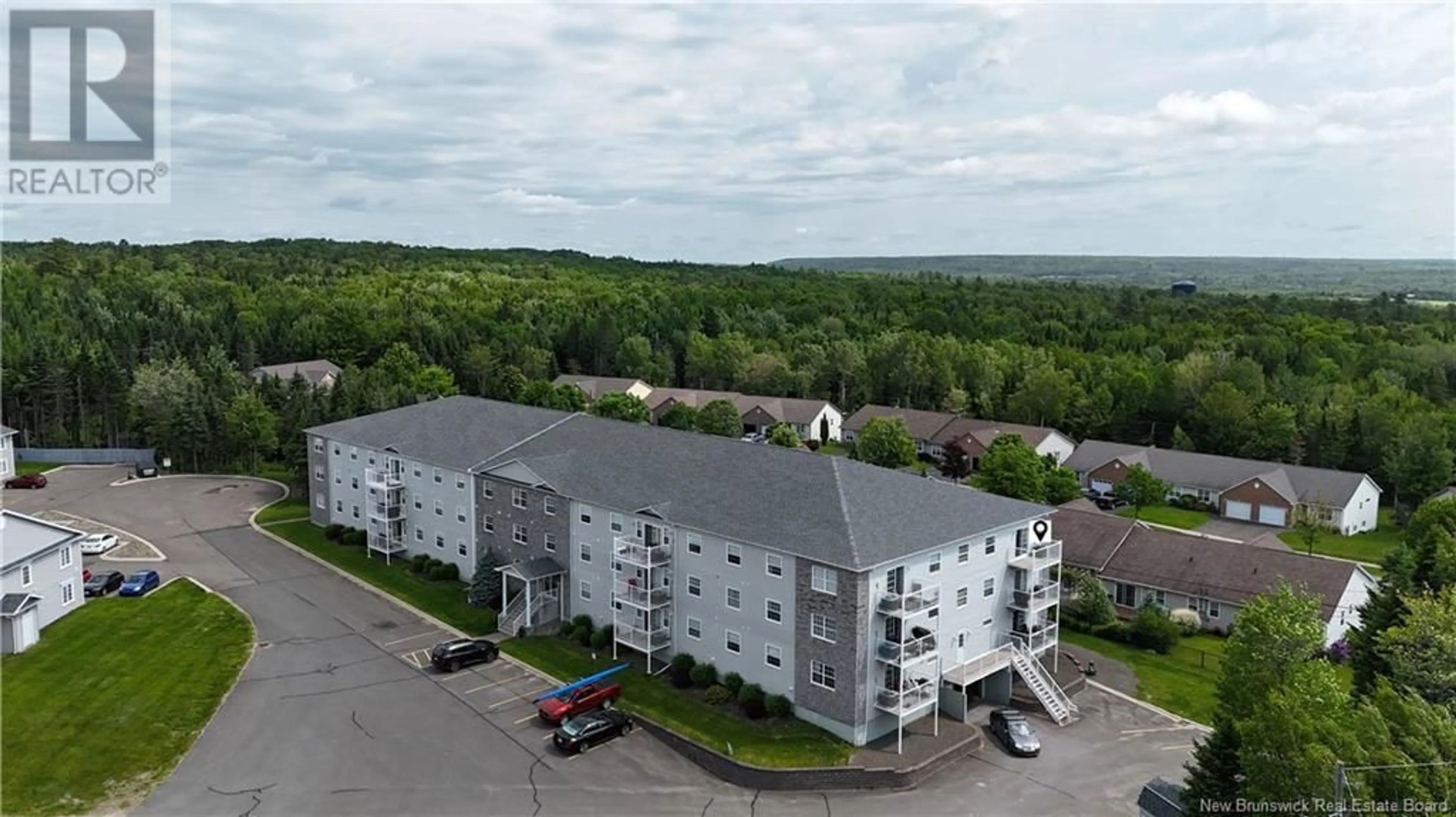 A pic from outside/outdoor area/front of a property/back of a property/a pic from drone, building for 301 - 40 BROWN BOULEVARD, Fredericton New Brunswick E3A0L7