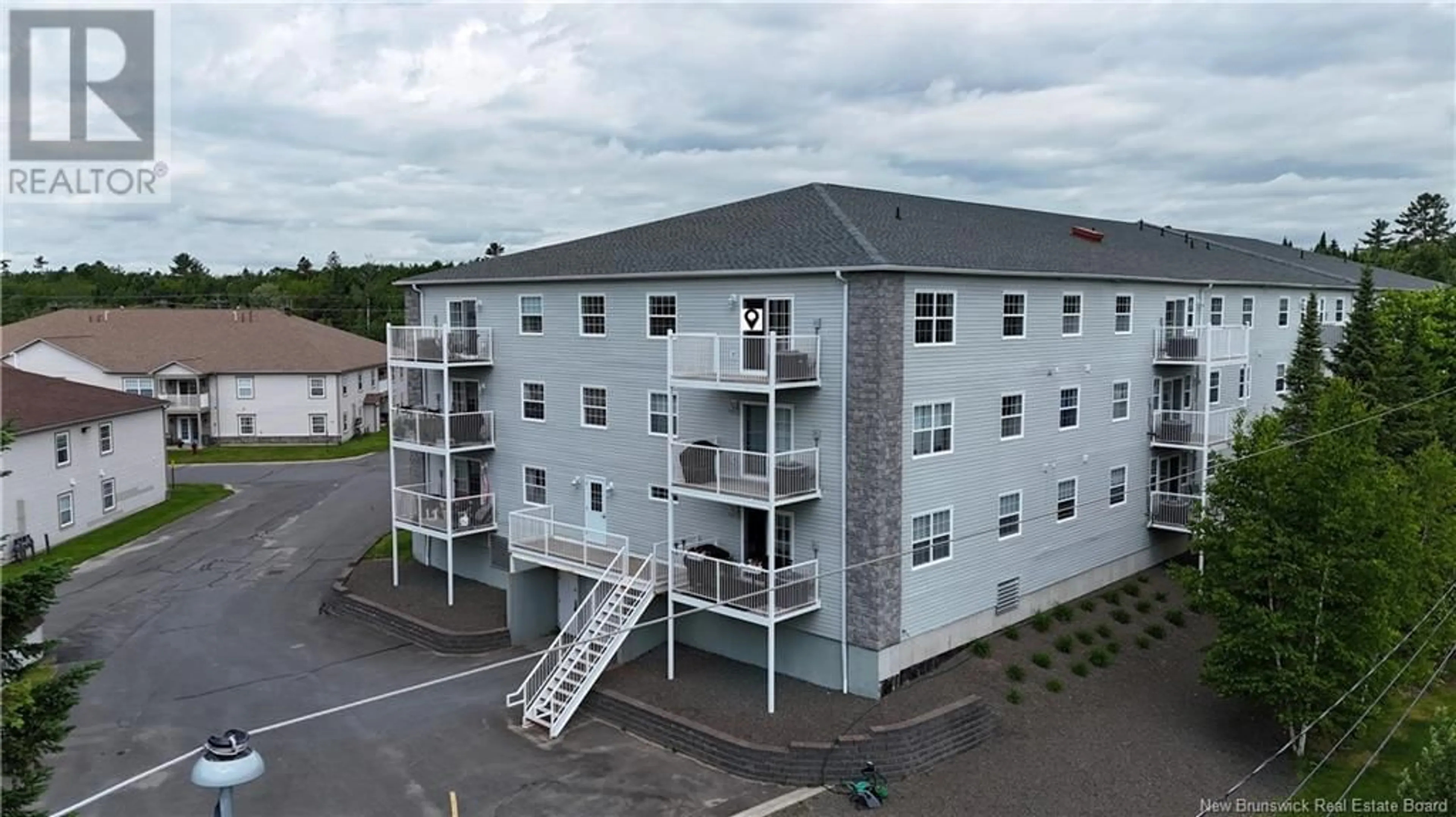 A pic from outside/outdoor area/front of a property/back of a property/a pic from drone, building for 301 - 40 BROWN BOULEVARD, Fredericton New Brunswick E3A0L7