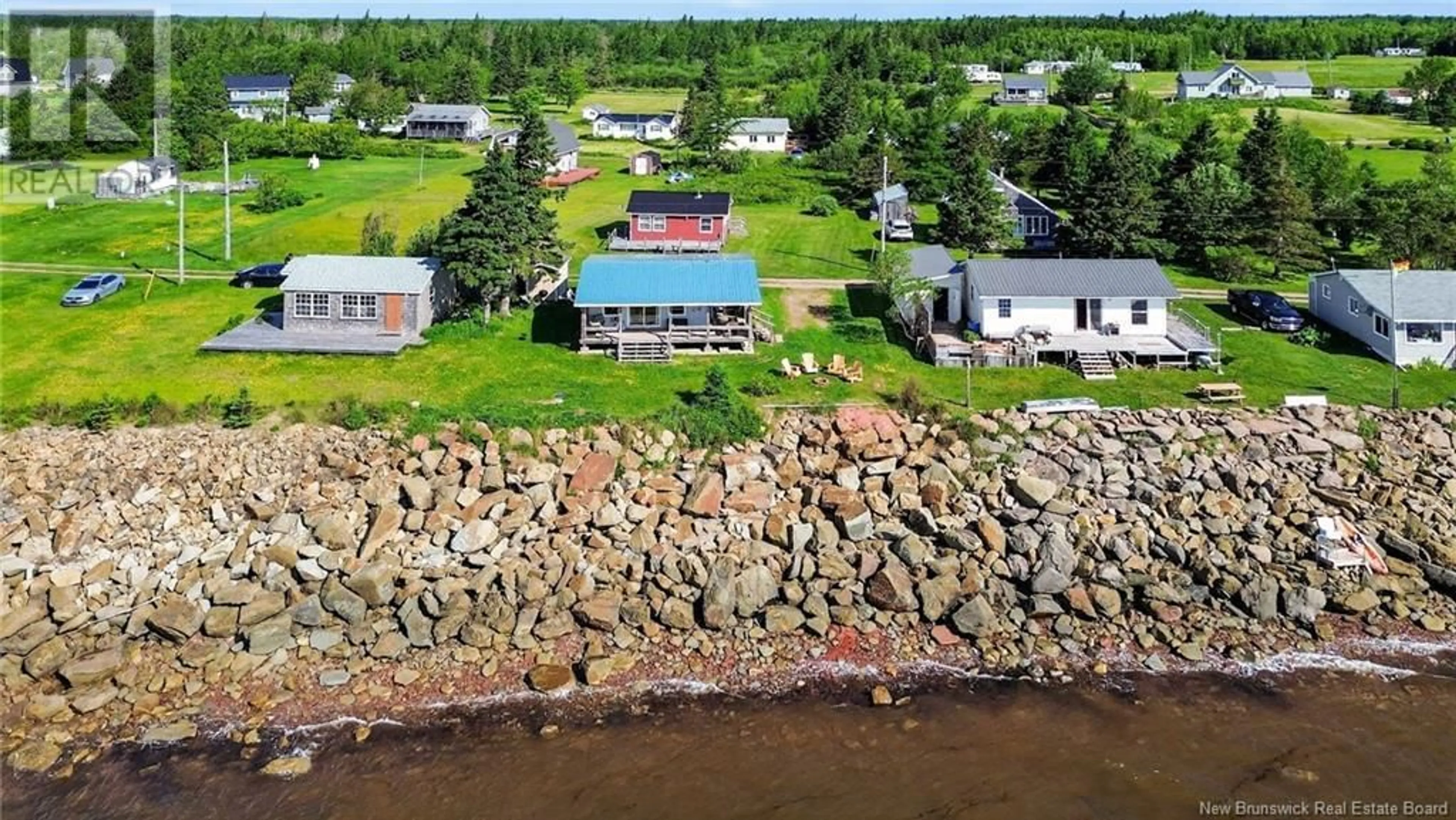 A pic from outside/outdoor area/front of a property/back of a property/a pic from drone, water/lake/river/ocean view for 95 HICKS FRONT BEACH, Upper Cape New Brunswick E4L3E7