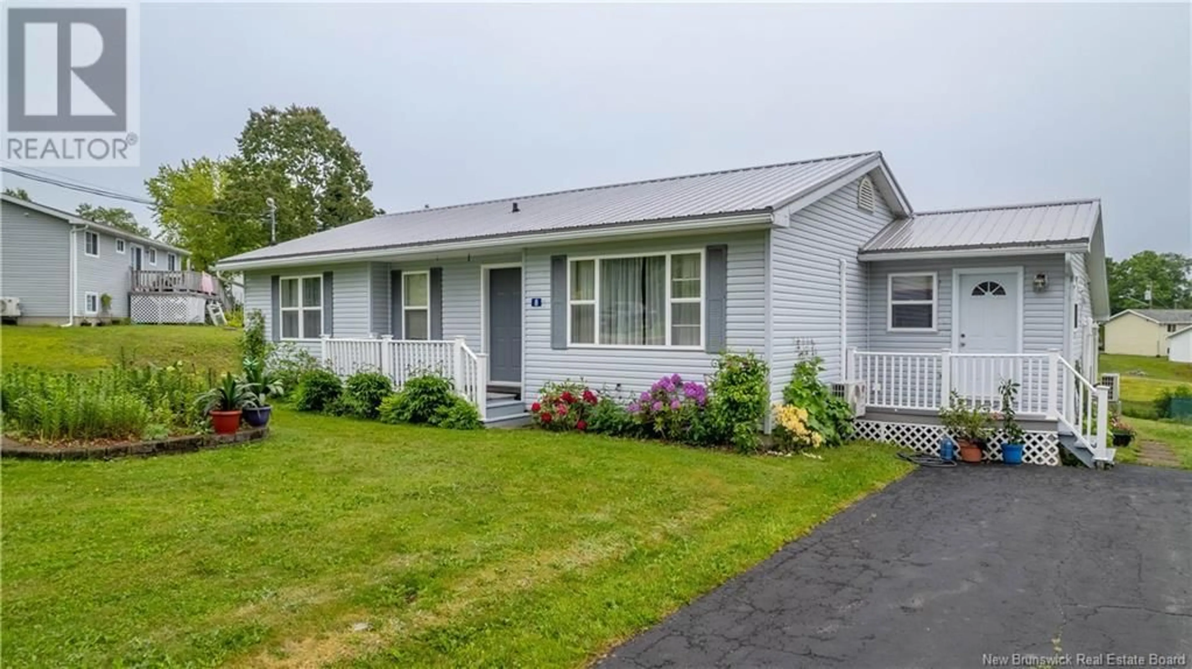 Home with vinyl exterior material, street for 8 HILLCREST DRIVE, St George New Brunswick W5C3G1