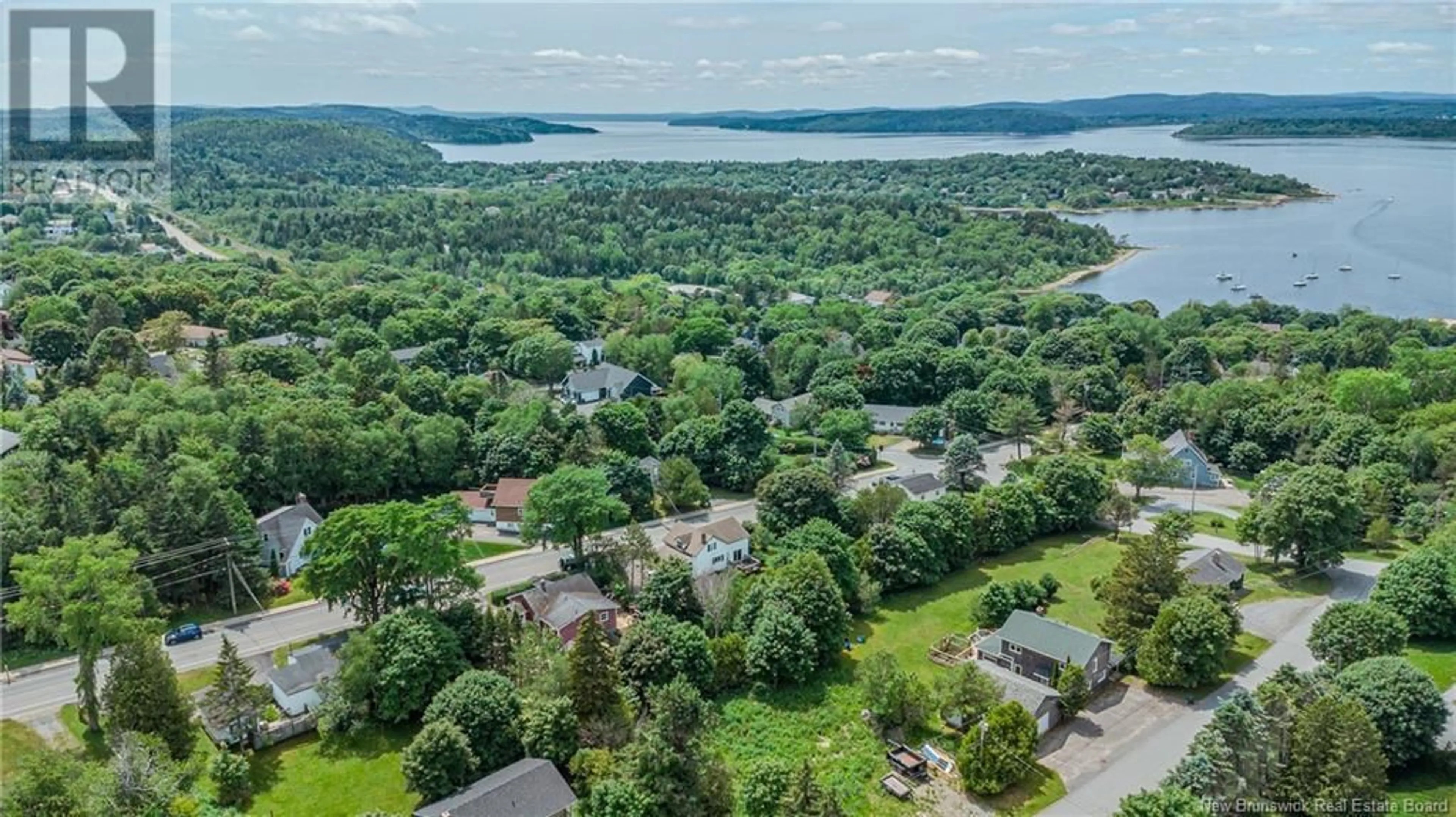 A pic from outside/outdoor area/front of a property/back of a property/a pic from drone, water/lake/river/ocean view for 87 FOX FARM ROAD, Rothesay New Brunswick E2H1J3