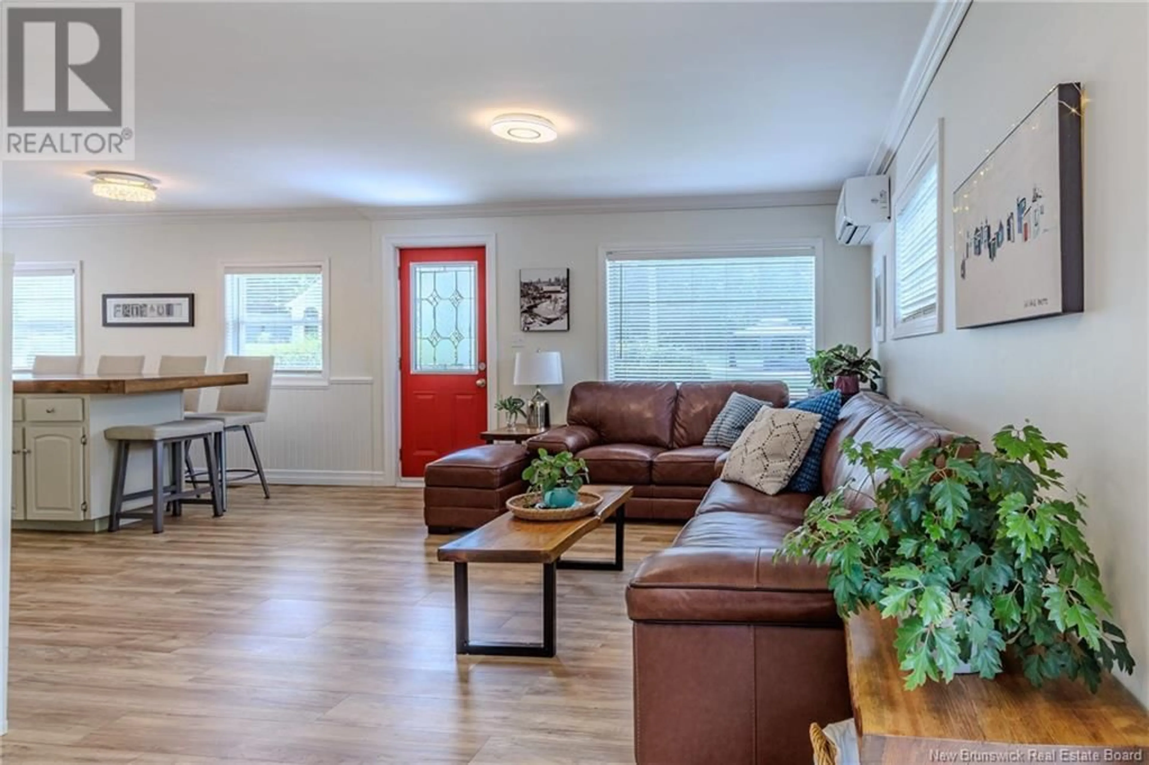 Living room with furniture, wood/laminate floor for 87 FOX FARM ROAD, Rothesay New Brunswick E2H1J3