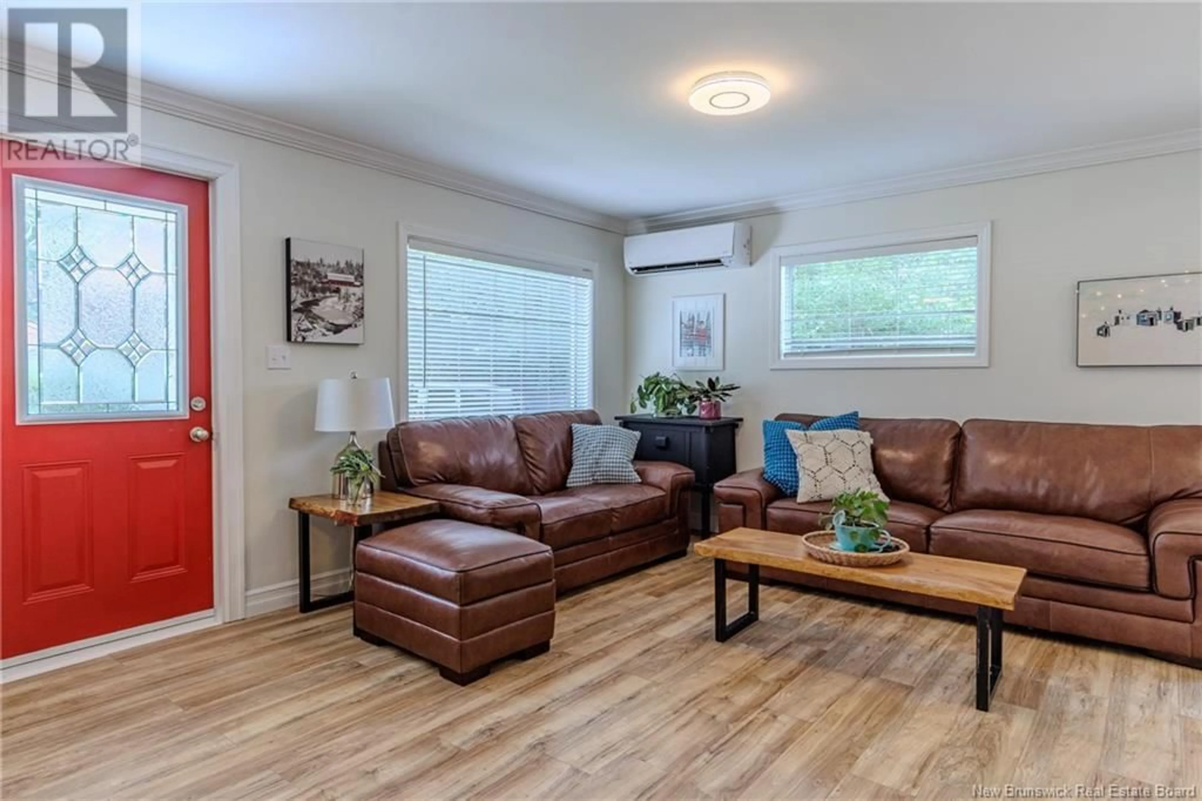 Living room with furniture, wood/laminate floor for 87 FOX FARM ROAD, Rothesay New Brunswick E2H1J3
