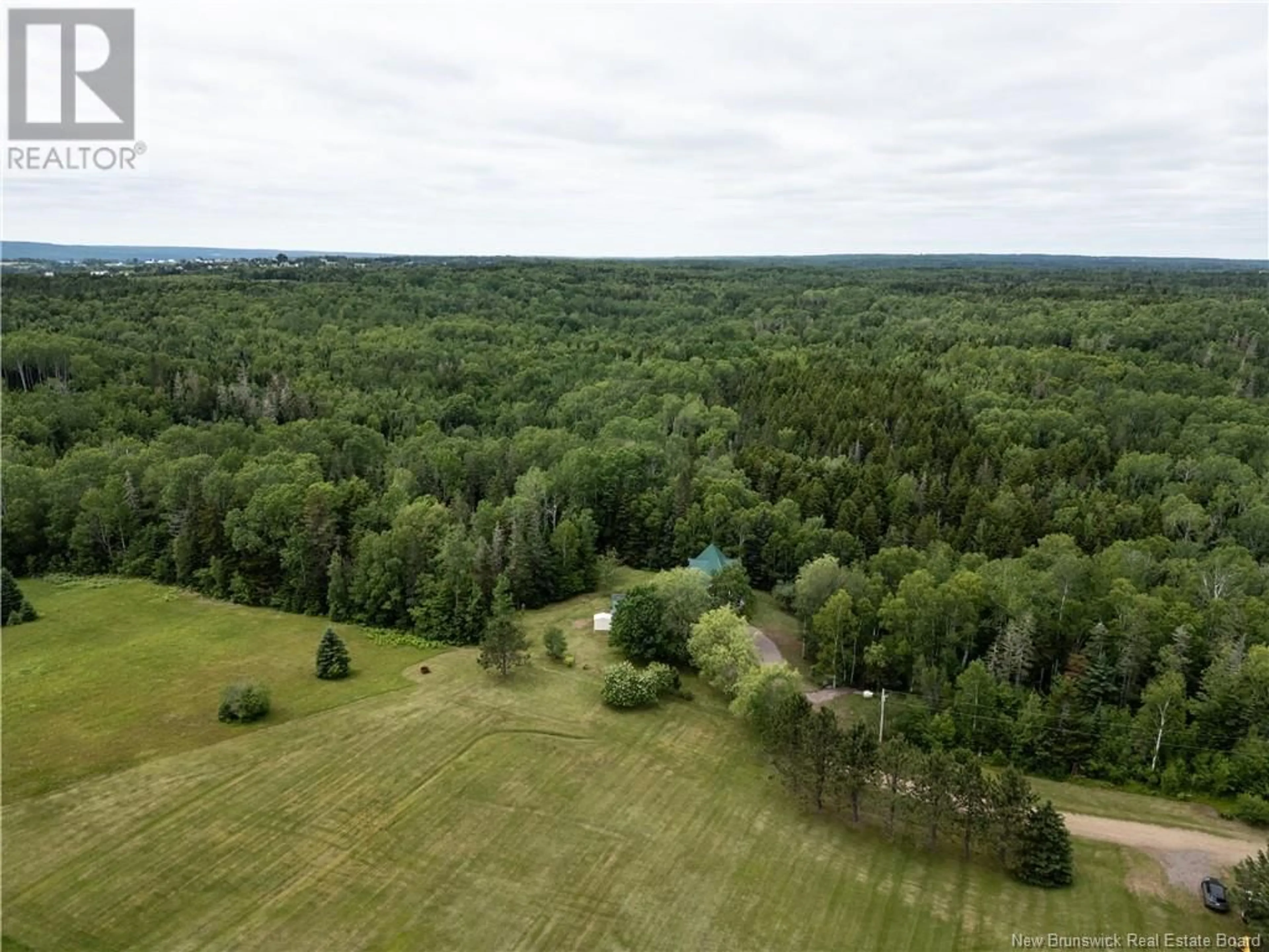 A pic from outside/outdoor area/front of a property/back of a property/a pic from drone, forest/trees view for 180 BUNKER LANE, Memramcook New Brunswick E4K3V9
