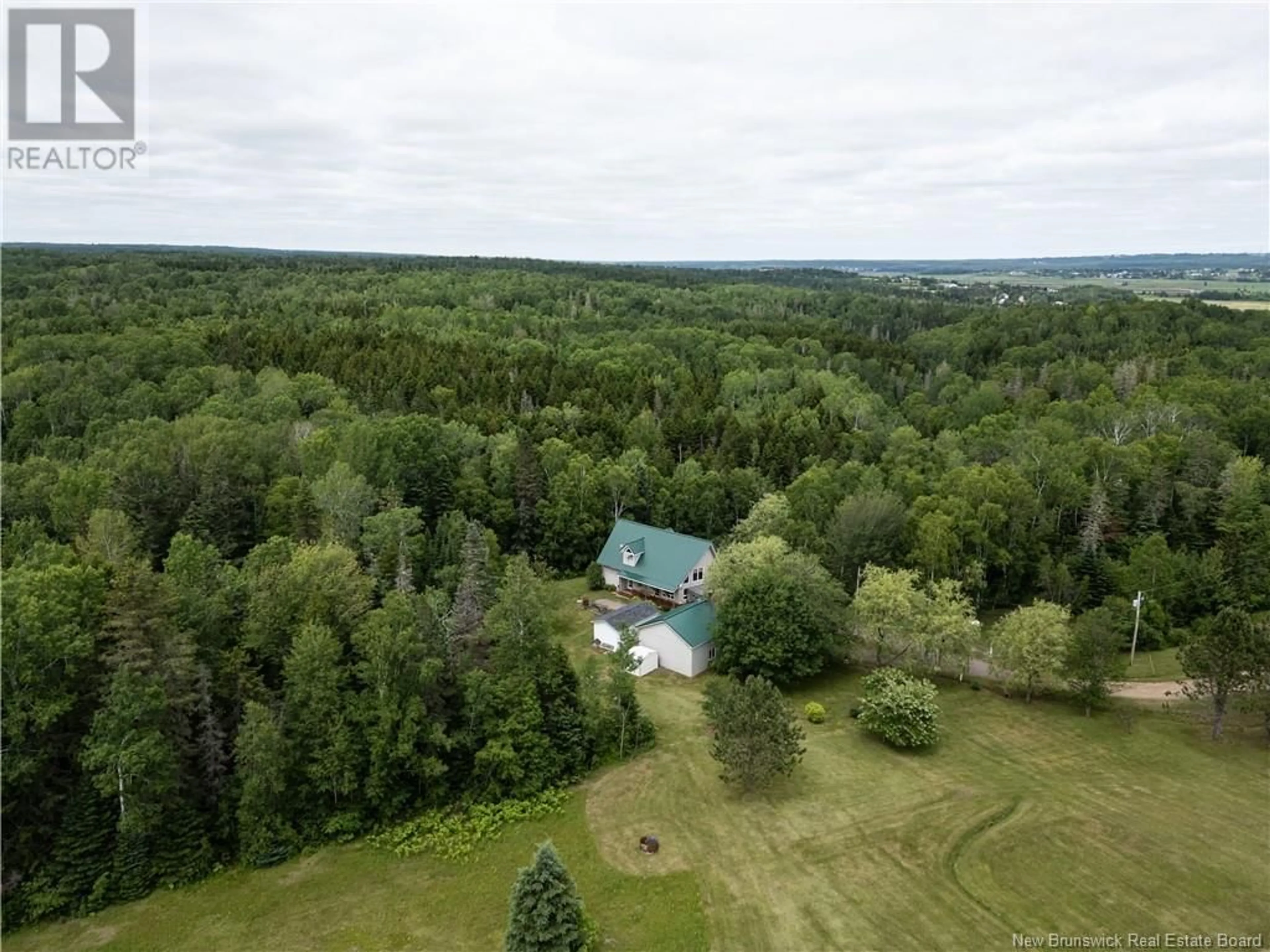 A pic from outside/outdoor area/front of a property/back of a property/a pic from drone, forest/trees view for 180 BUNKER LANE, Memramcook New Brunswick E4K3V9