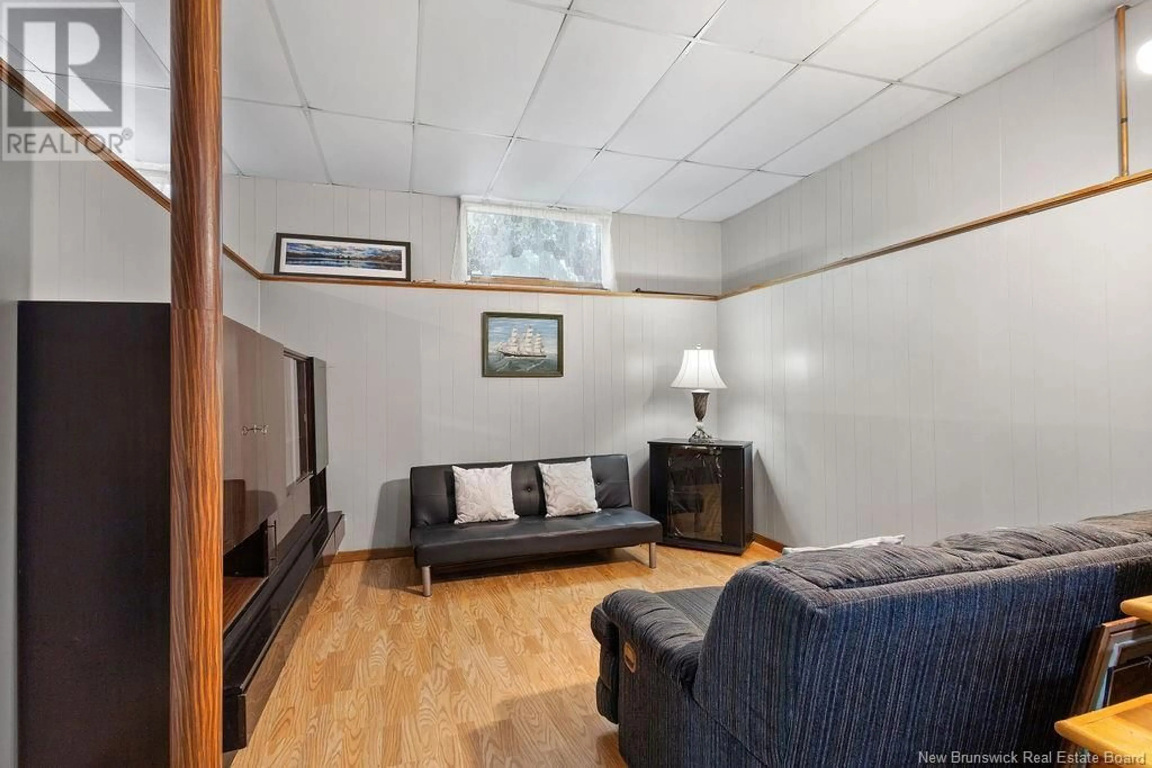 Living room with furniture, wood/laminate floor for 97 UNIVERSITY AVENUE, Miramichi New Brunswick E1N2V6