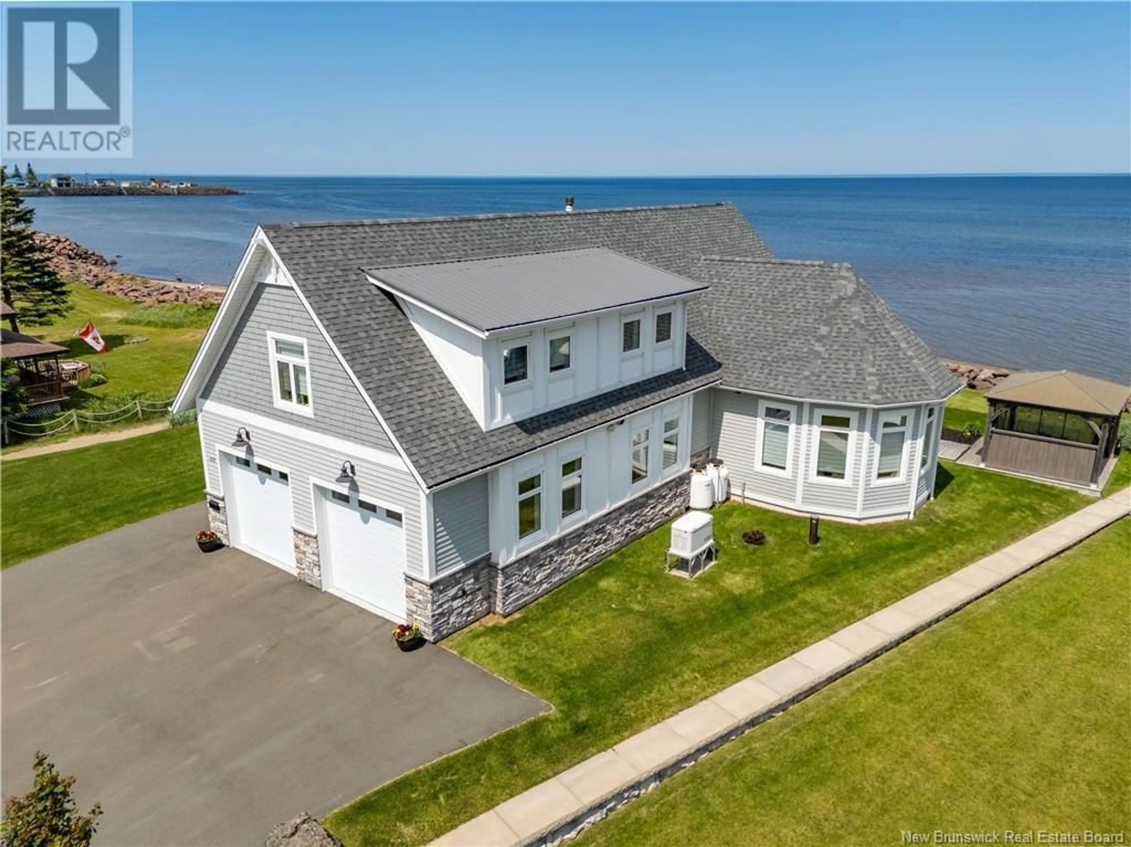 A pic from outside/outdoor area/front of a property/back of a property/a pic from drone, water/lake/river/ocean view for 476 DE LA COTE, Grande-Digue New Brunswick E4R4B5
