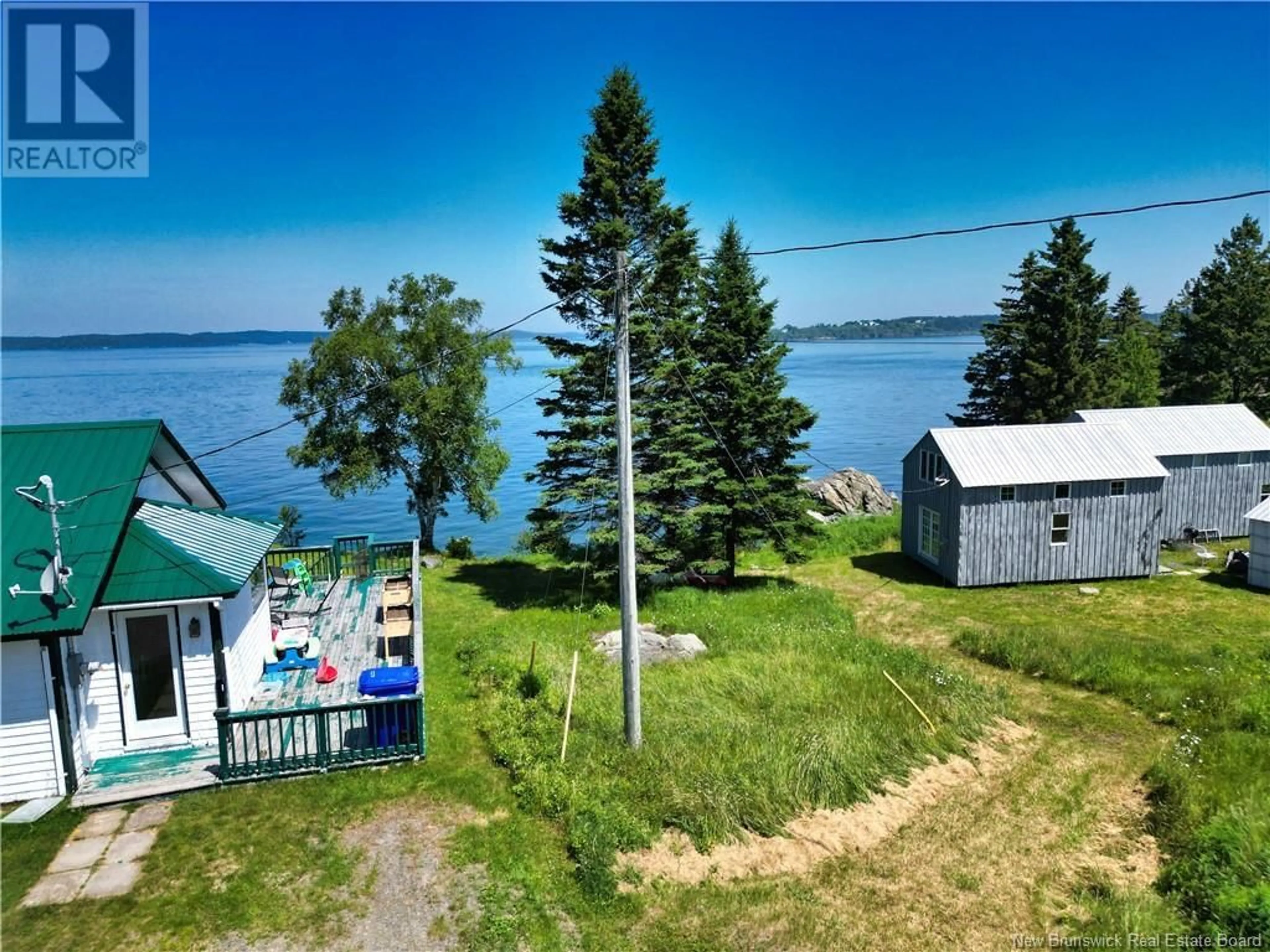 A pic from outside/outdoor area/front of a property/back of a property/a pic from drone, water/lake/river/ocean view for 770 NORTH ROAD, Welshpool New Brunswick E5E1E3