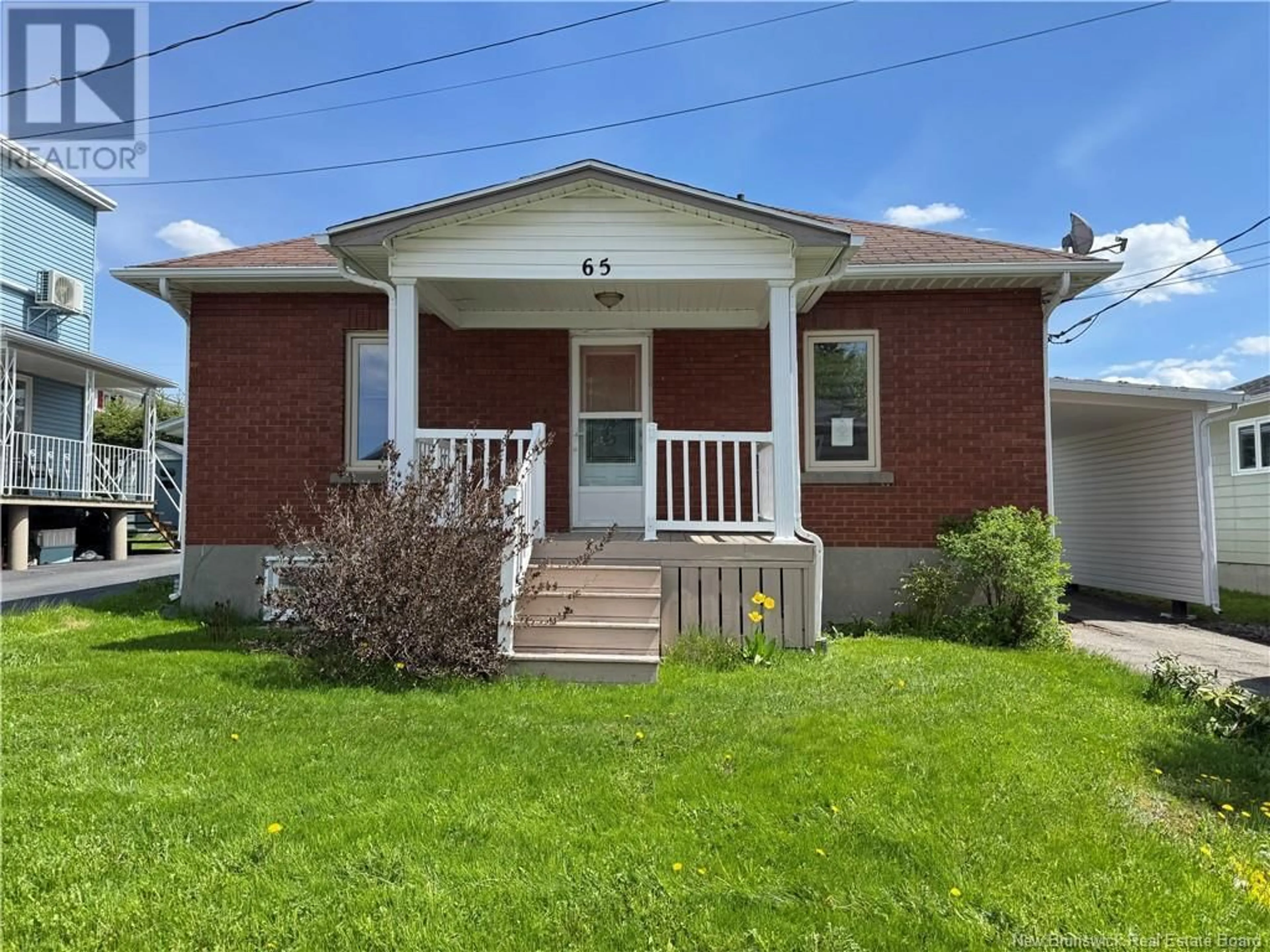 Home with brick exterior material, street for 65 ST.-GEORGES, Edmundston New Brunswick E3V2W1
