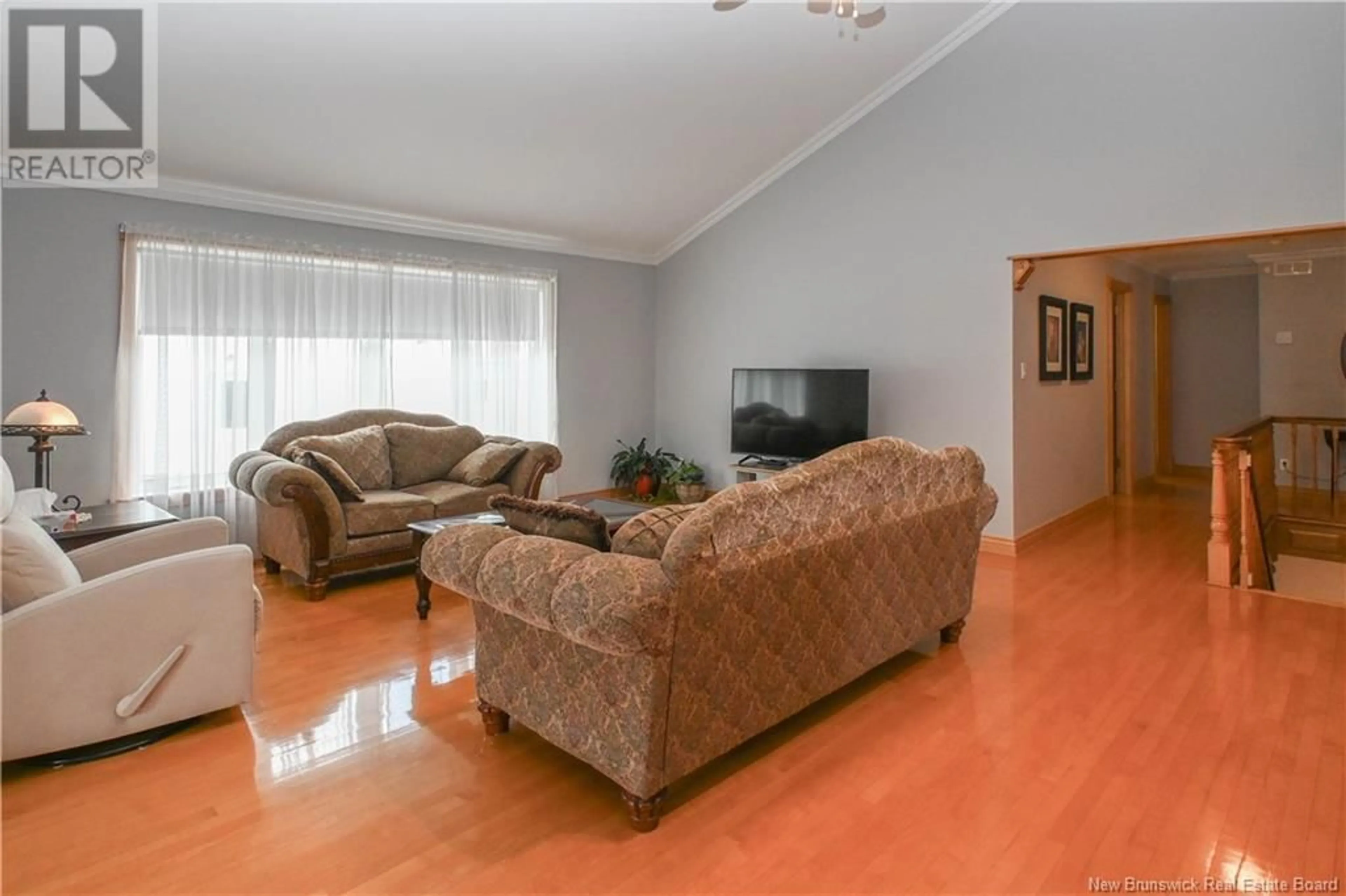 Living room with furniture, wood/laminate floor for 981 135 ROUTE ROUTE, Duguayville New Brunswick E8M1K3