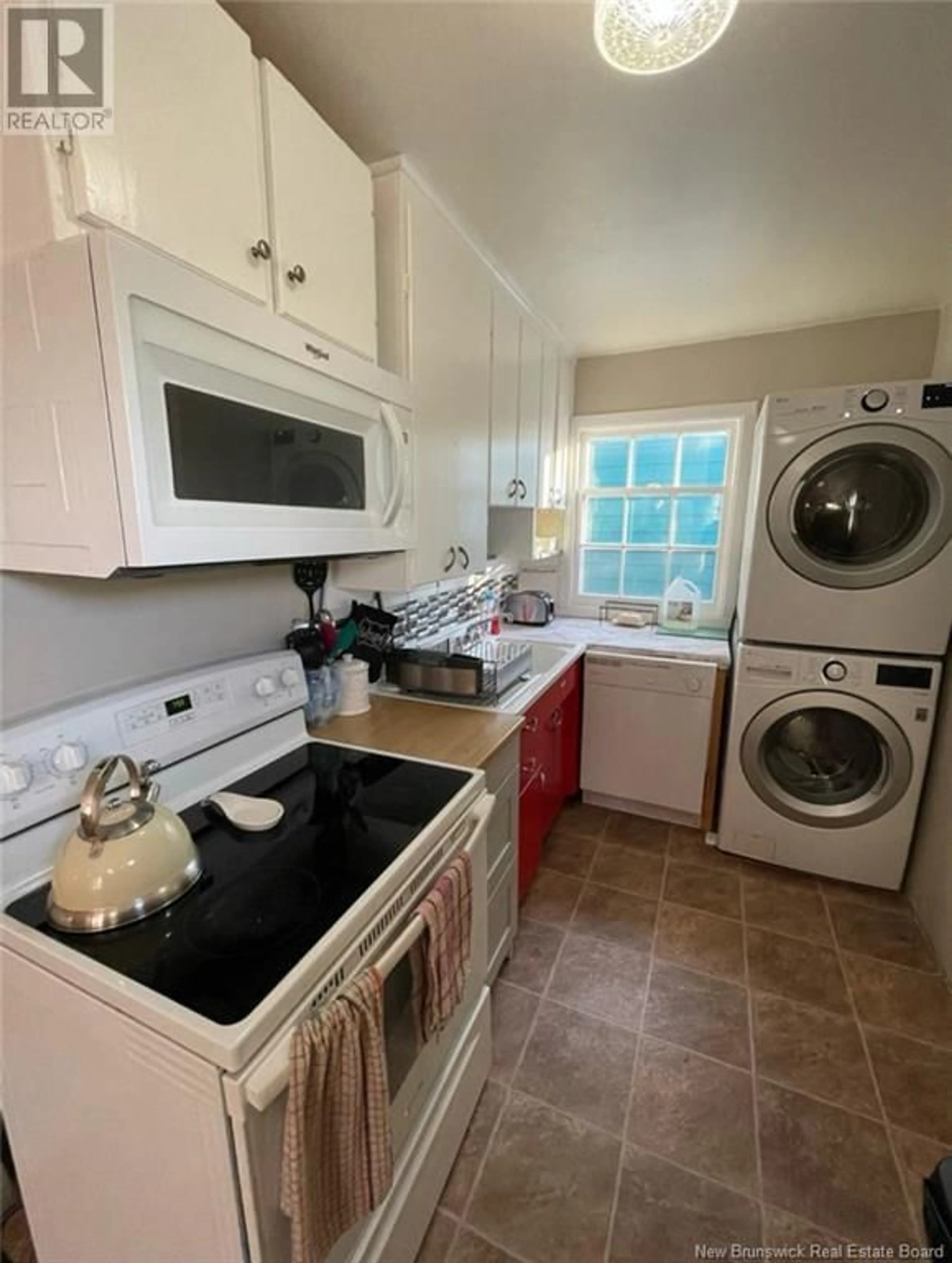 Kitchen with laundary machines, ceramic/tile floor for 105 COURTENAY AVENUE, Saint John New Brunswick E2J1N2