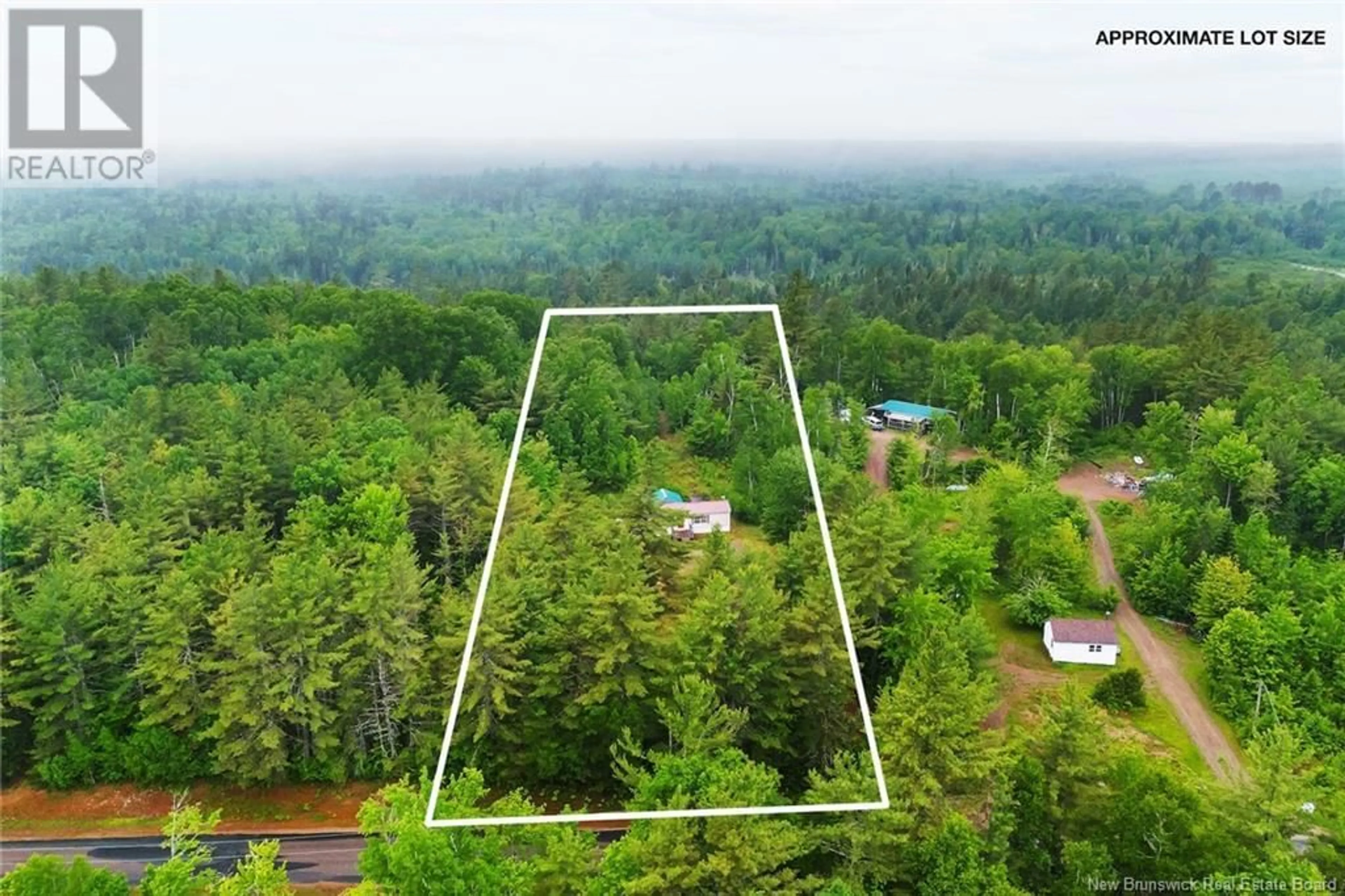 A pic from outside/outdoor area/front of a property/back of a property/a pic from drone, forest/trees view for 34 LAKE ROAD, South Oromocto Lake New Brunswick E5L2S8
