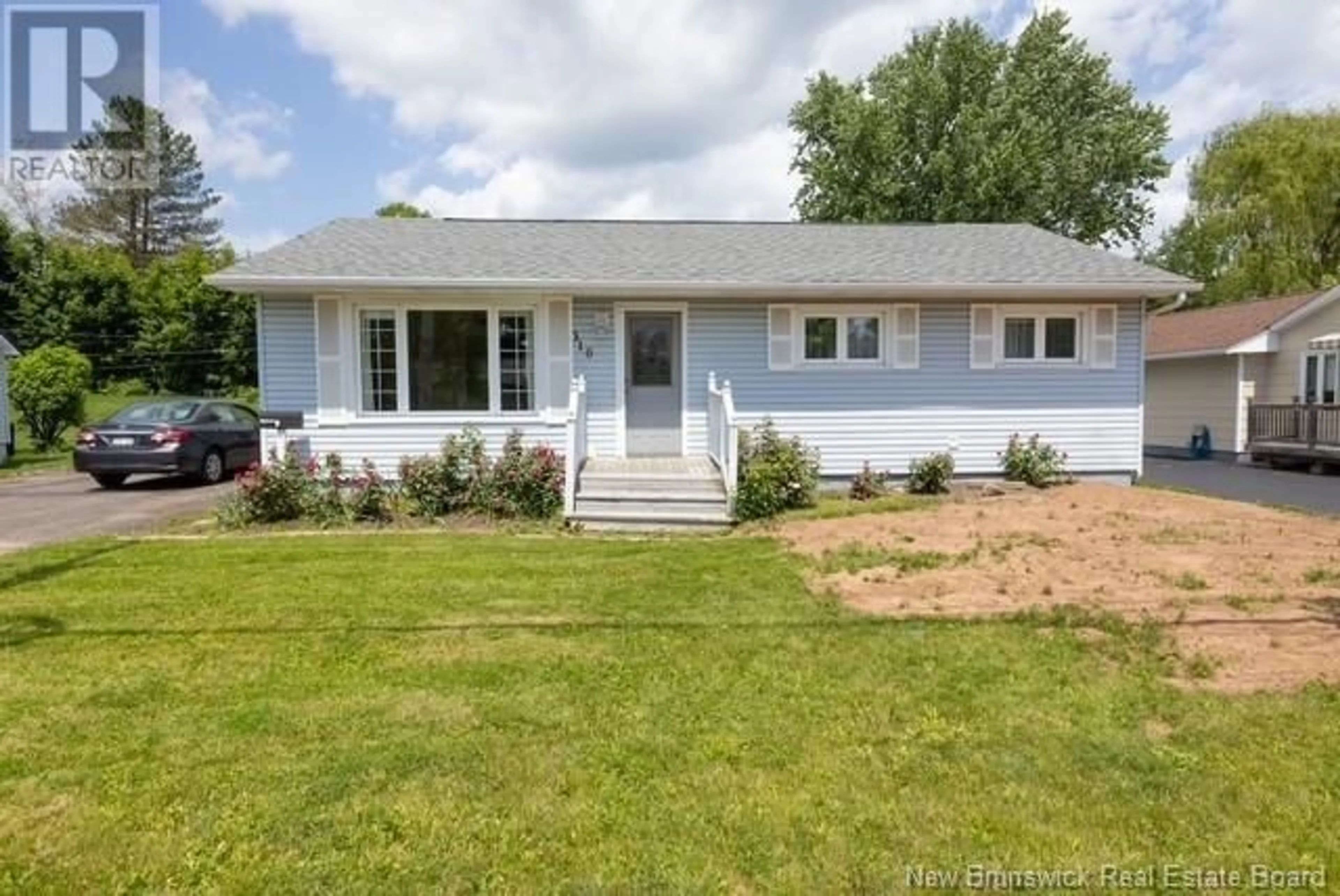 Home with vinyl exterior material, street for 310 MAPLE STREET, Fredericton New Brunswick E3A3R4