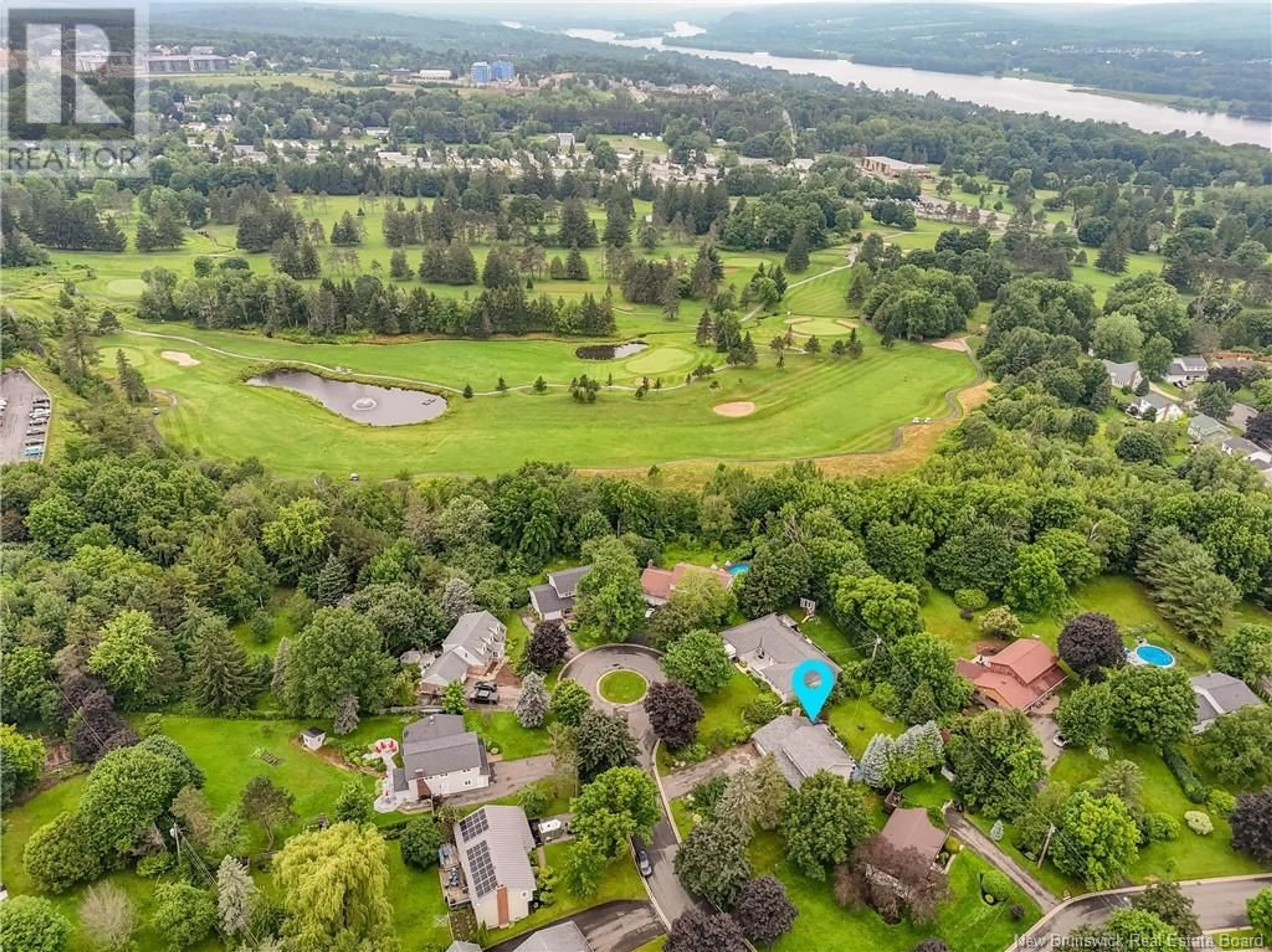 A pic from outside/outdoor area/front of a property/back of a property/a pic from drone, water/lake/river/ocean view for 73 BURNHAM COURT, Fredericton New Brunswick E3B5T8