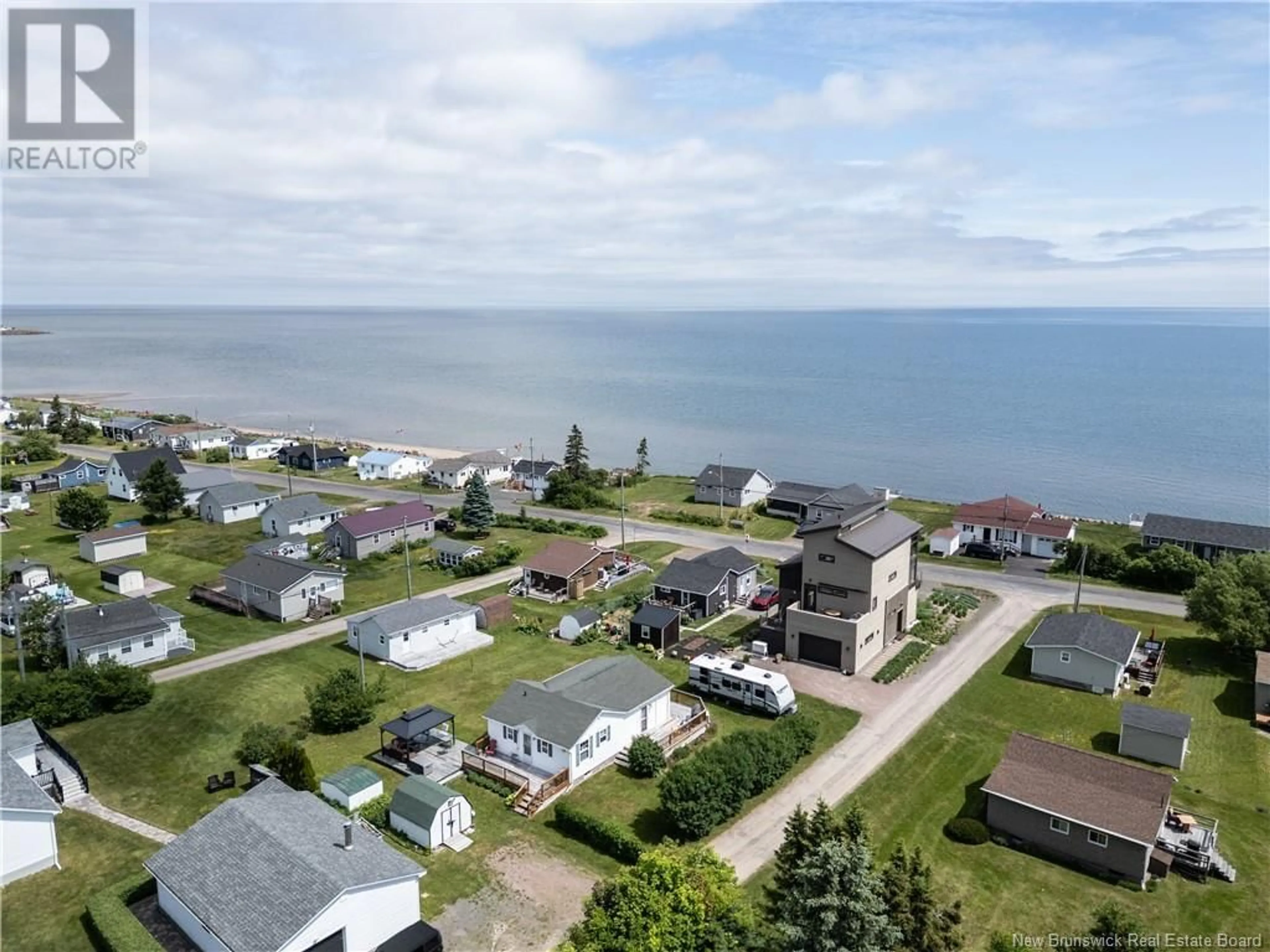 A pic from outside/outdoor area/front of a property/back of a property/a pic from drone, water/lake/river/ocean view for 20 LOBSTER LANE, Grande-Digue New Brunswick E4R4A7