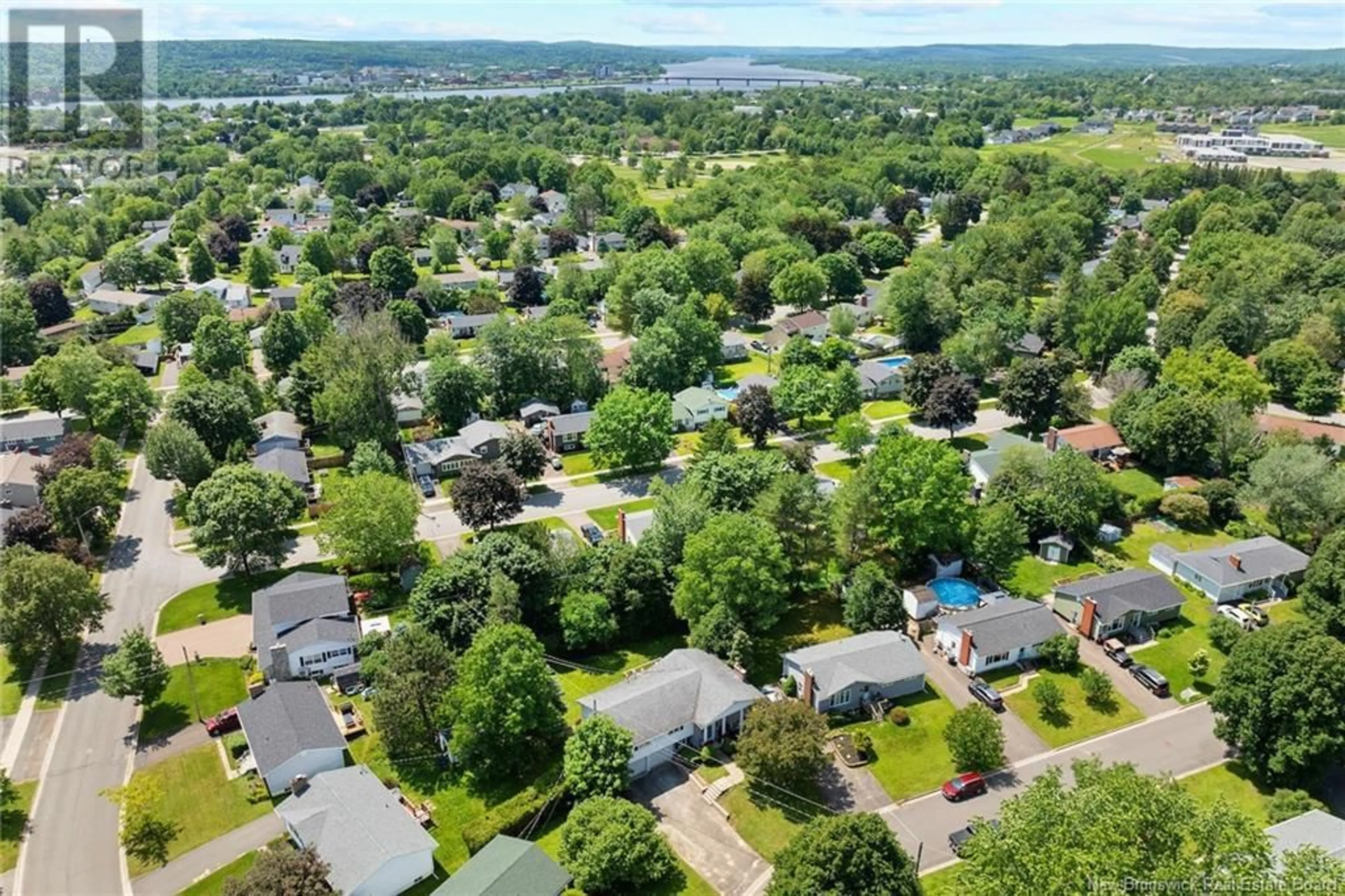 A pic from outside/outdoor area/front of a property/back of a property/a pic from drone, water/lake/river/ocean view for 14 MATTHEWS COURT, Fredericton New Brunswick E3A4Y7