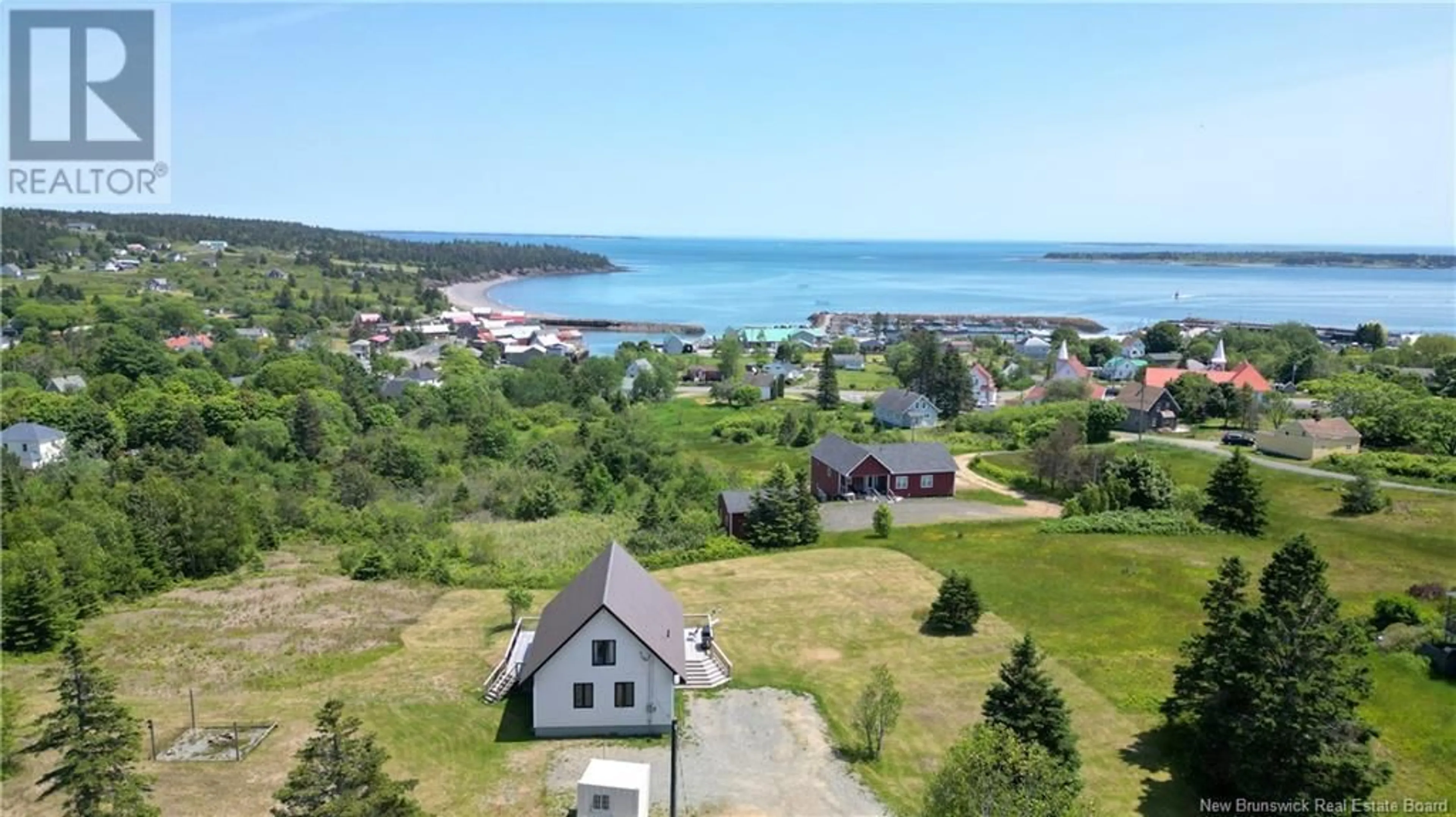A pic from outside/outdoor area/front of a property/back of a property/a pic from drone, water/lake/river/ocean view for 2 TEAKETTLE LANE, Grand Manan New Brunswick E5G2J8