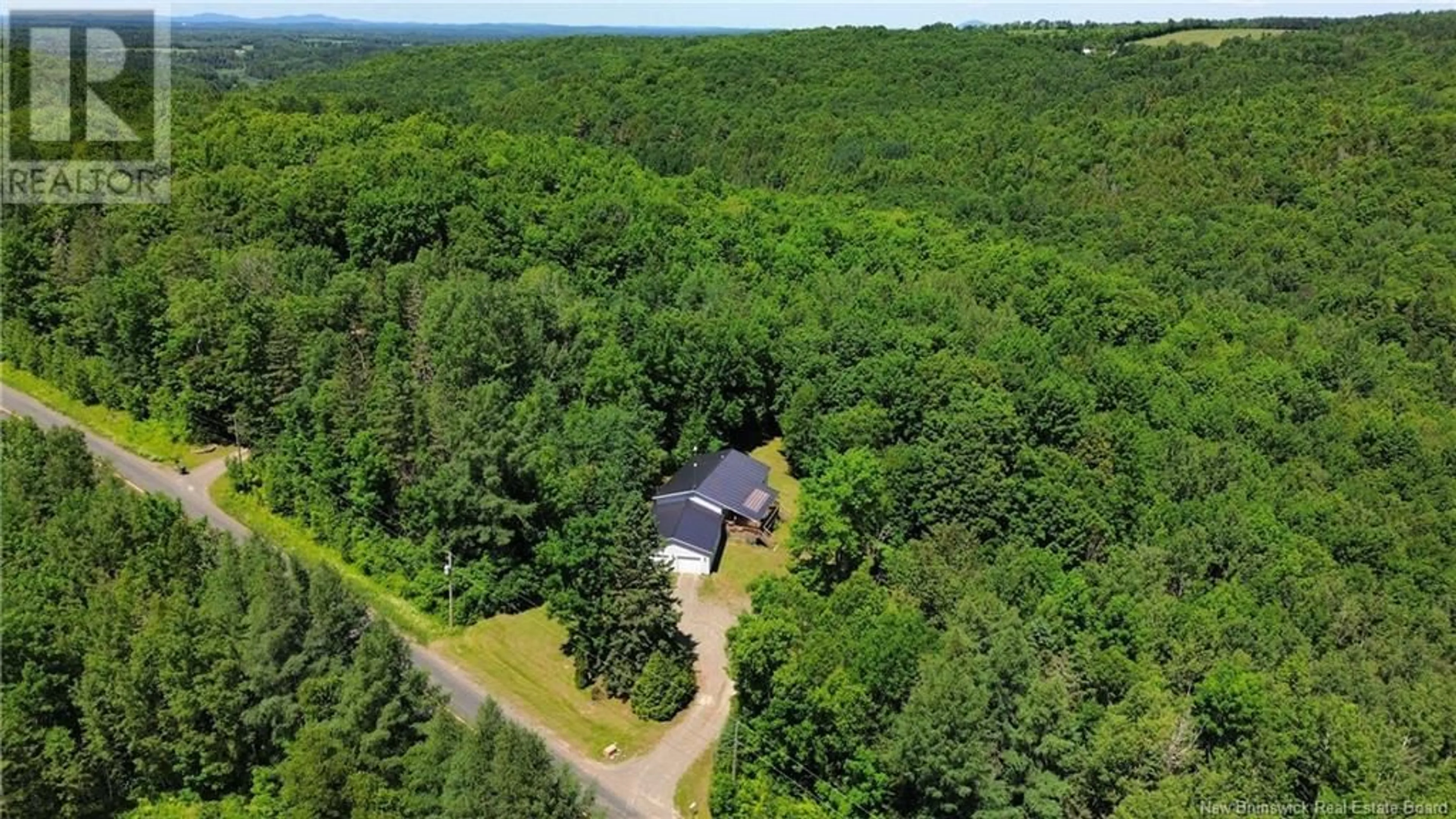 A pic from outside/outdoor area/front of a property/back of a property/a pic from drone, forest/trees view for 4456 ROUTE 540, Belleville New Brunswick E7M5T6