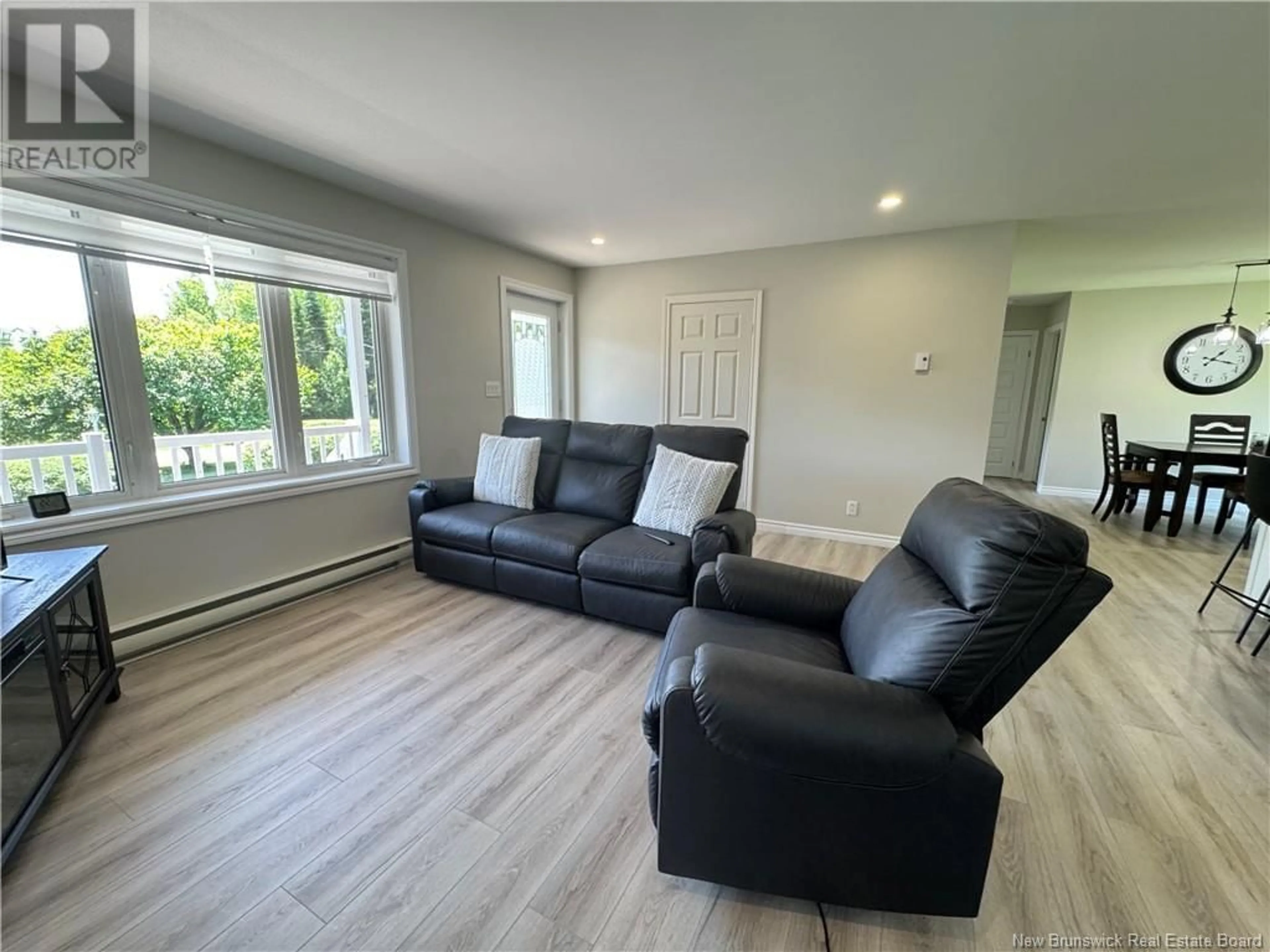 Living room with furniture, wood/laminate floor for 74 PETIT OUEST ROAD, Kedgwick New Brunswick E8B1T7