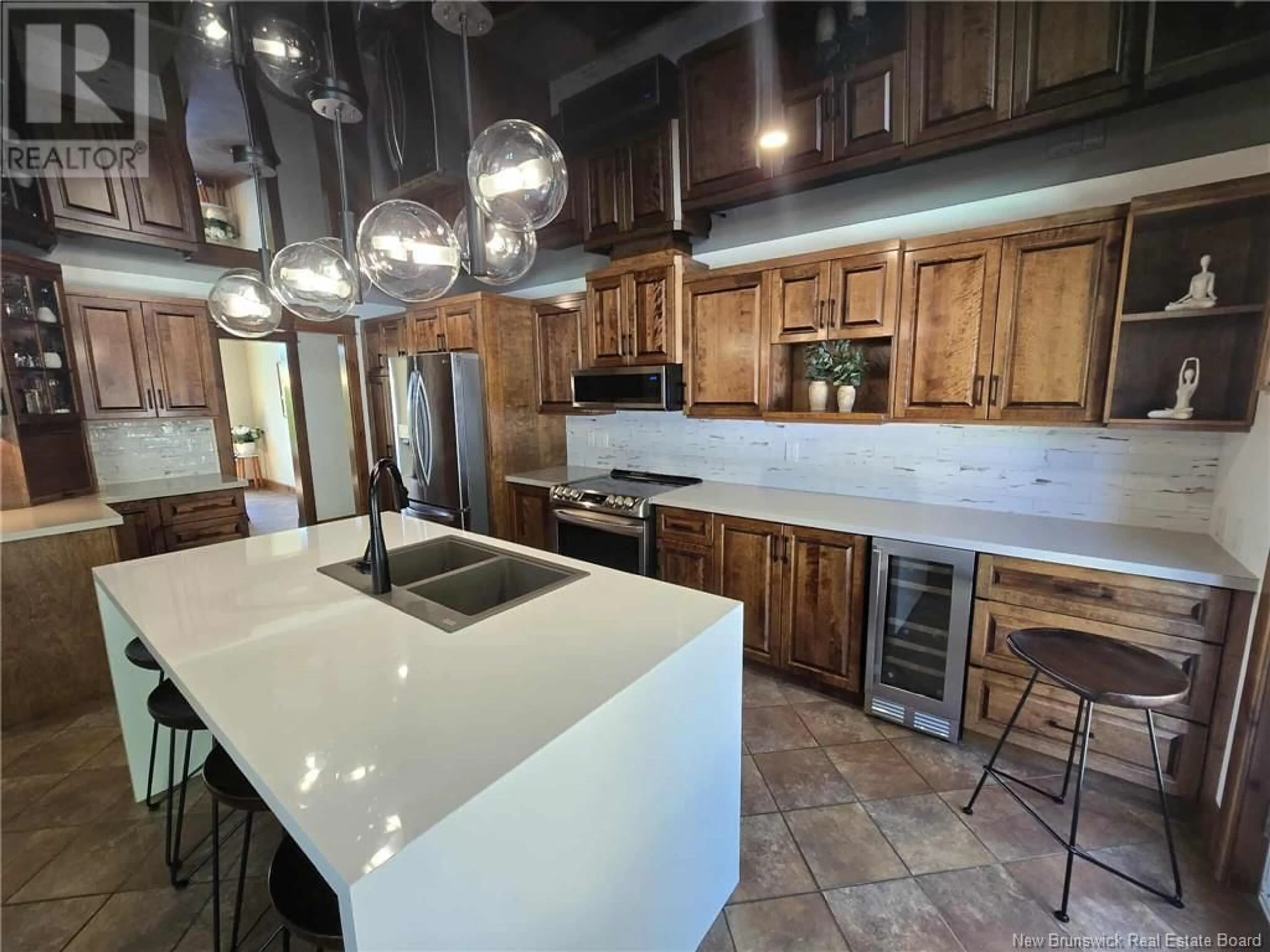 Open concept kitchen, ceramic/tile floor for 192 JACQUES STREET, Beresford New Brunswick E8K0A1