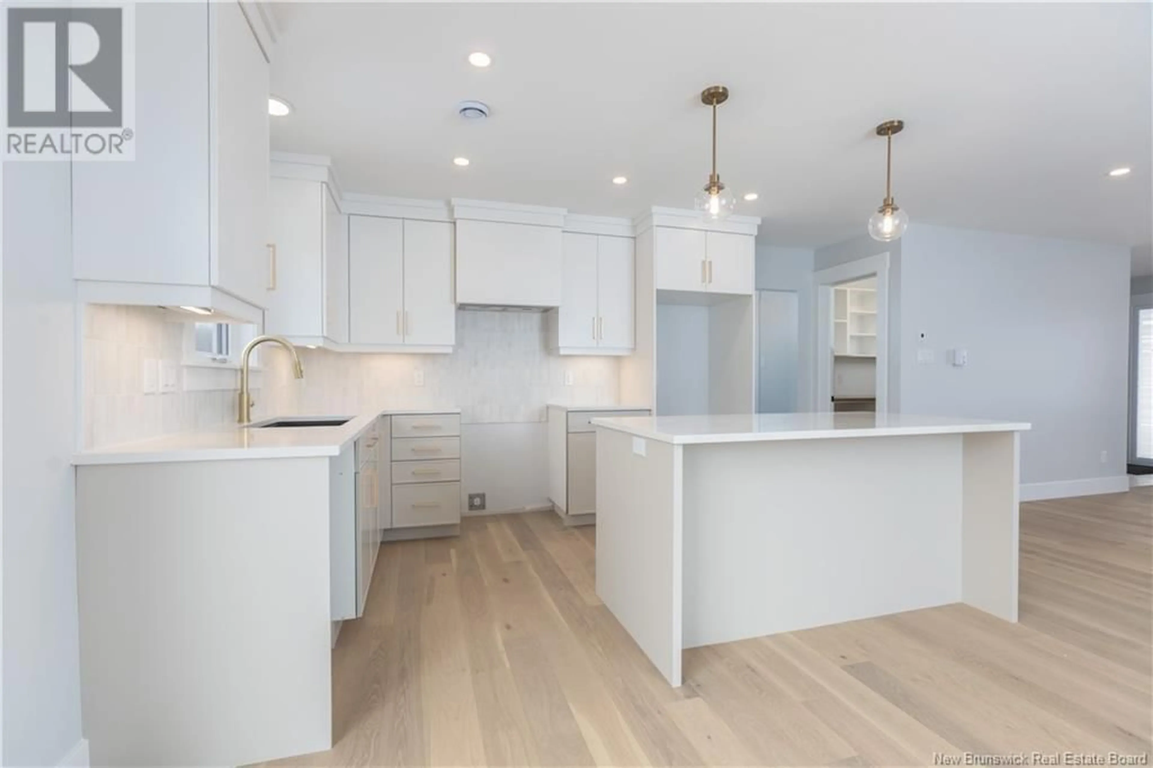 Open concept kitchen, wood/laminate floor for 93 MELBOURNE CRESCENT, Moncton New Brunswick E1E0K5