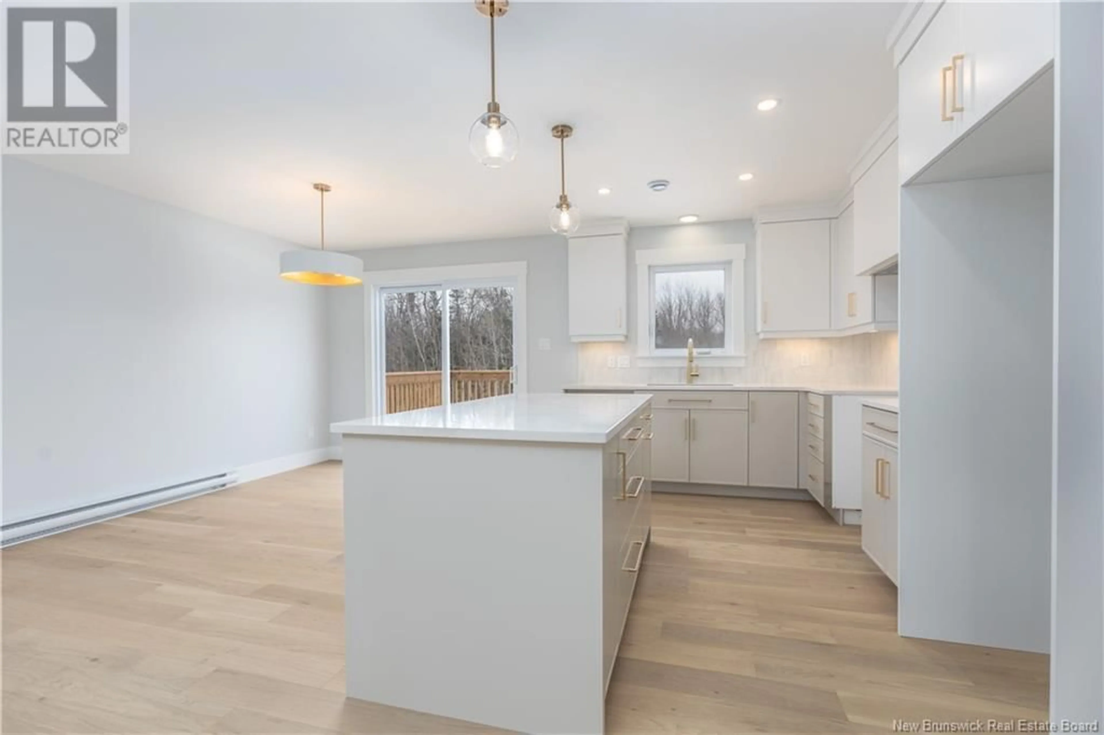 Open concept kitchen, wood/laminate floor for 93 MELBOURNE CRESCENT, Moncton New Brunswick E1E0K5