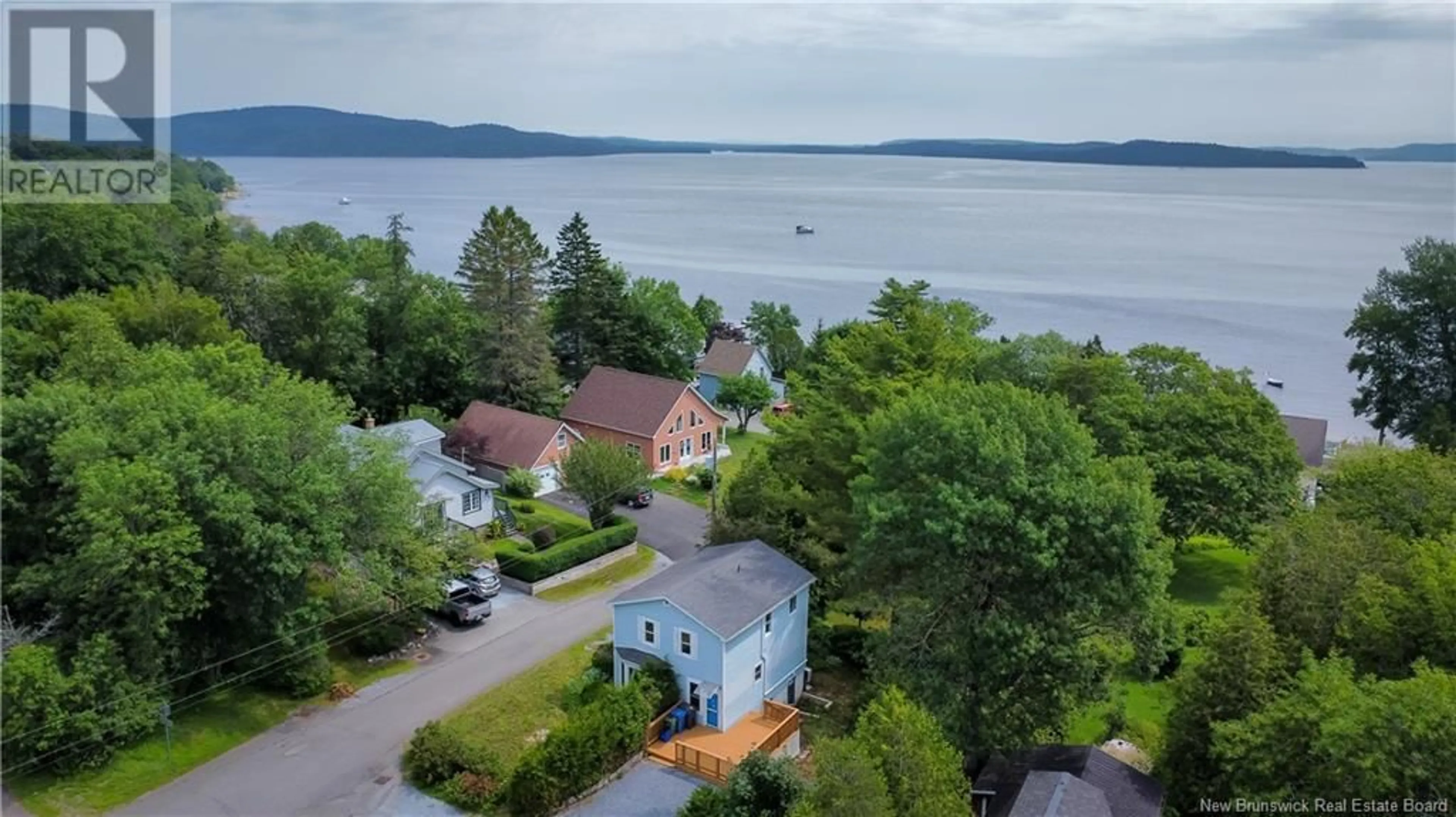 A pic from outside/outdoor area/front of a property/back of a property/a pic from drone, water/lake/river/ocean view for 12 BEACH ROAD, Grand Bay-Westfield New Brunswick E5K1P6