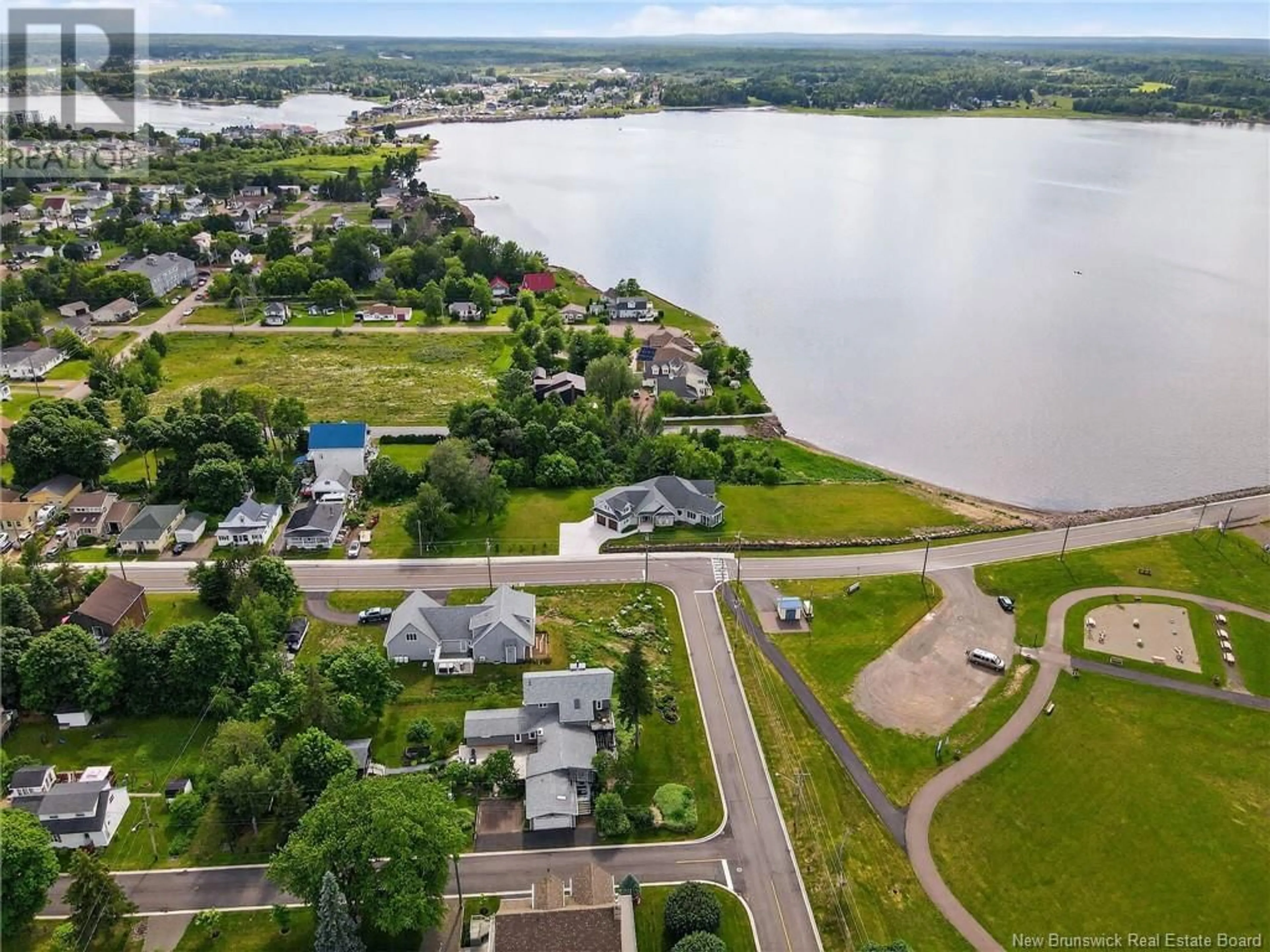 A pic from outside/outdoor area/front of a property/back of a property/a pic from drone, water/lake/river/ocean view for 235 CENTENNIAL DRIVE, Shediac New Brunswick E4P1L4