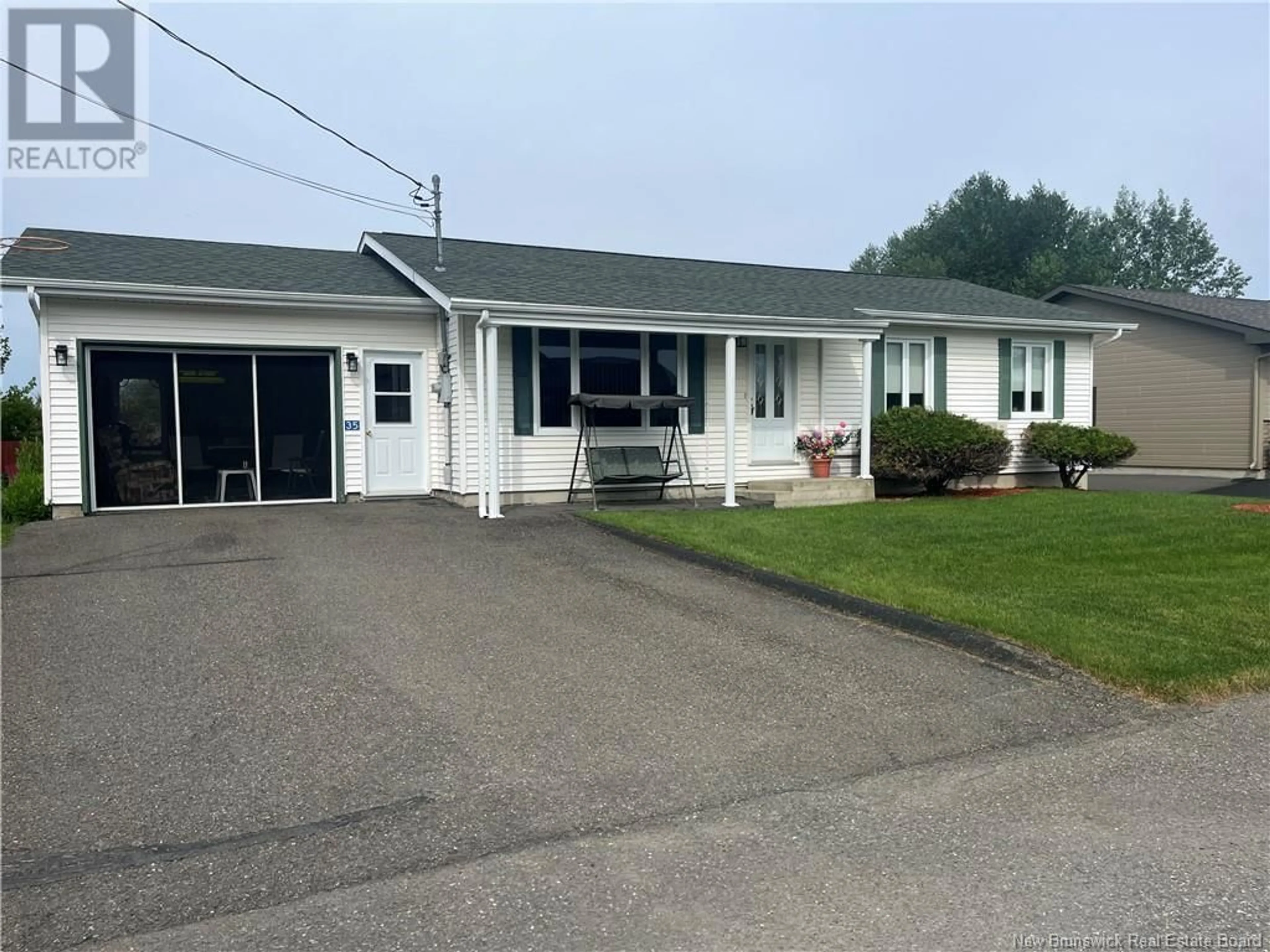 Home with vinyl exterior material, street for 35 MAZEROLLE STREET, Saint-Léonard New Brunswick E7E2A1