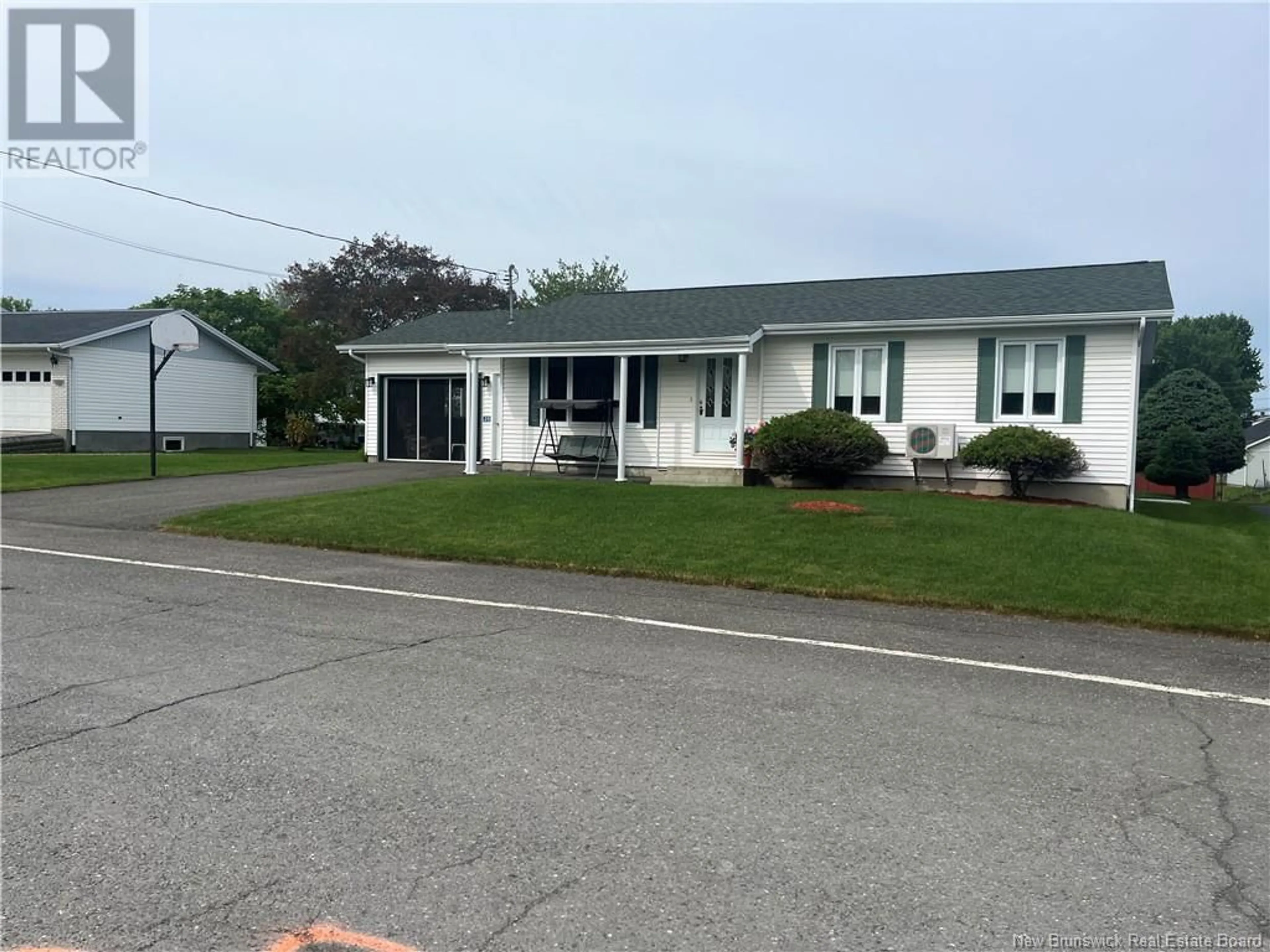 Home with vinyl exterior material, street for 35 MAZEROLLE STREET, Saint-Léonard New Brunswick E7E2A1