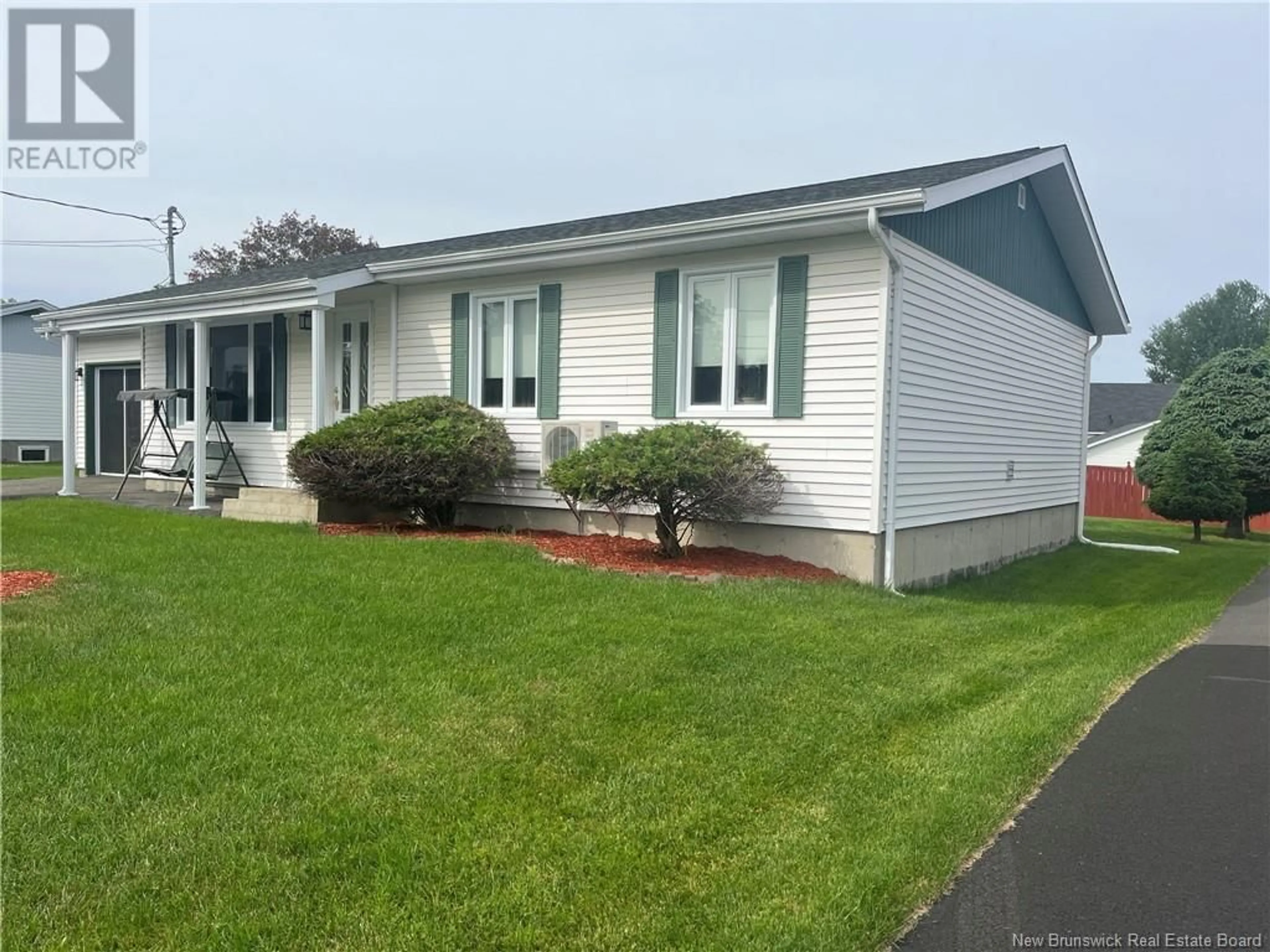 Home with vinyl exterior material, street for 35 MAZEROLLE STREET, Saint-Léonard New Brunswick E7E2A1