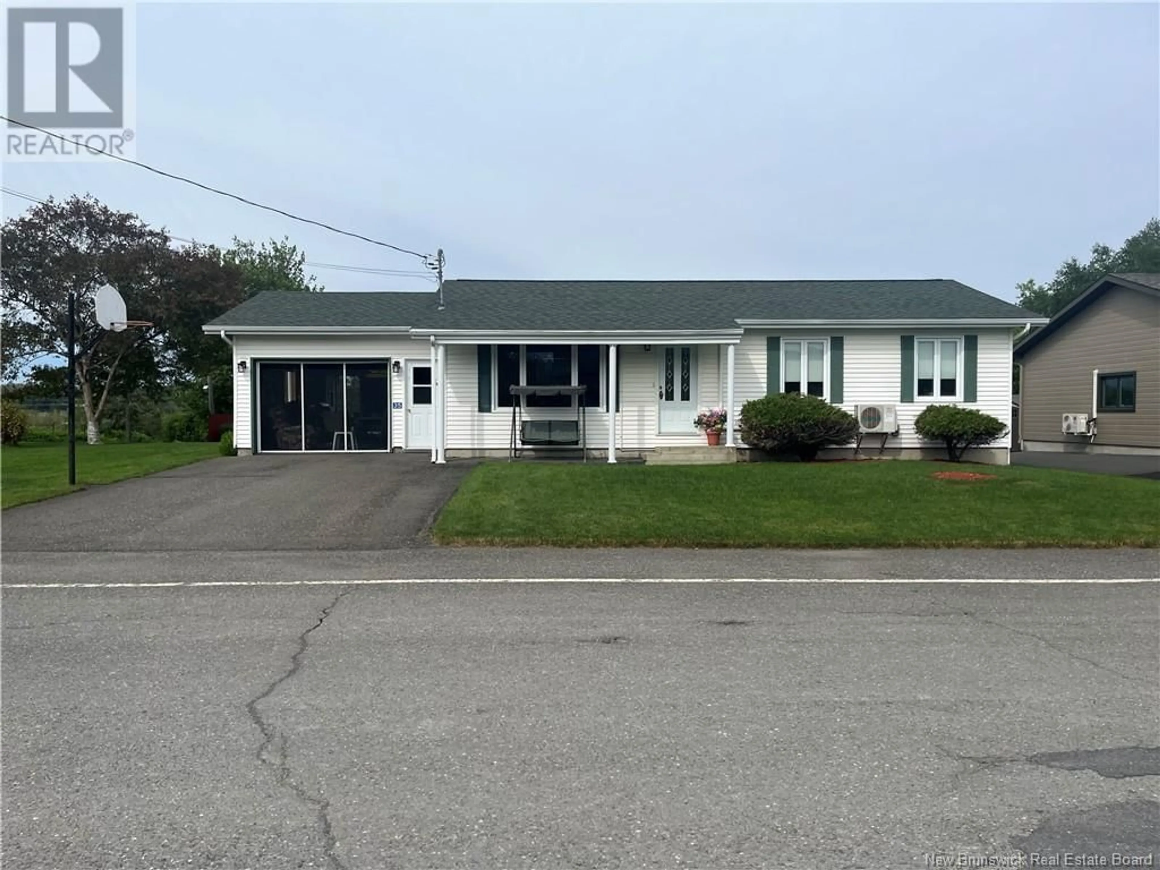 Home with vinyl exterior material, street for 35 MAZEROLLE STREET, Saint-Léonard New Brunswick E7E2A1