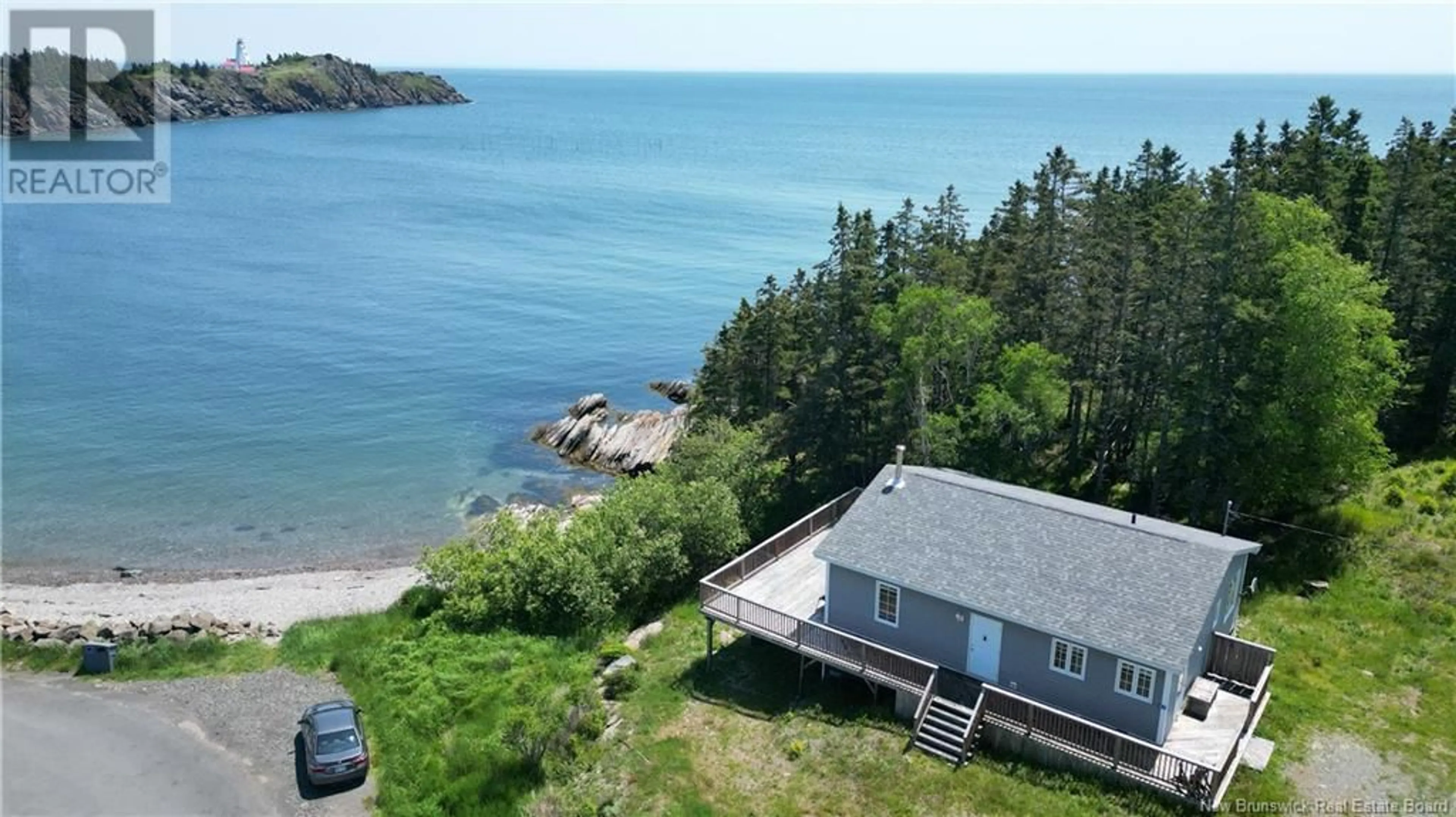 A pic from outside/outdoor area/front of a property/back of a property/a pic from drone, water/lake/river/ocean view for 22 PETTES COVE ROAD, Grand Manan New Brunswick E5G1A7