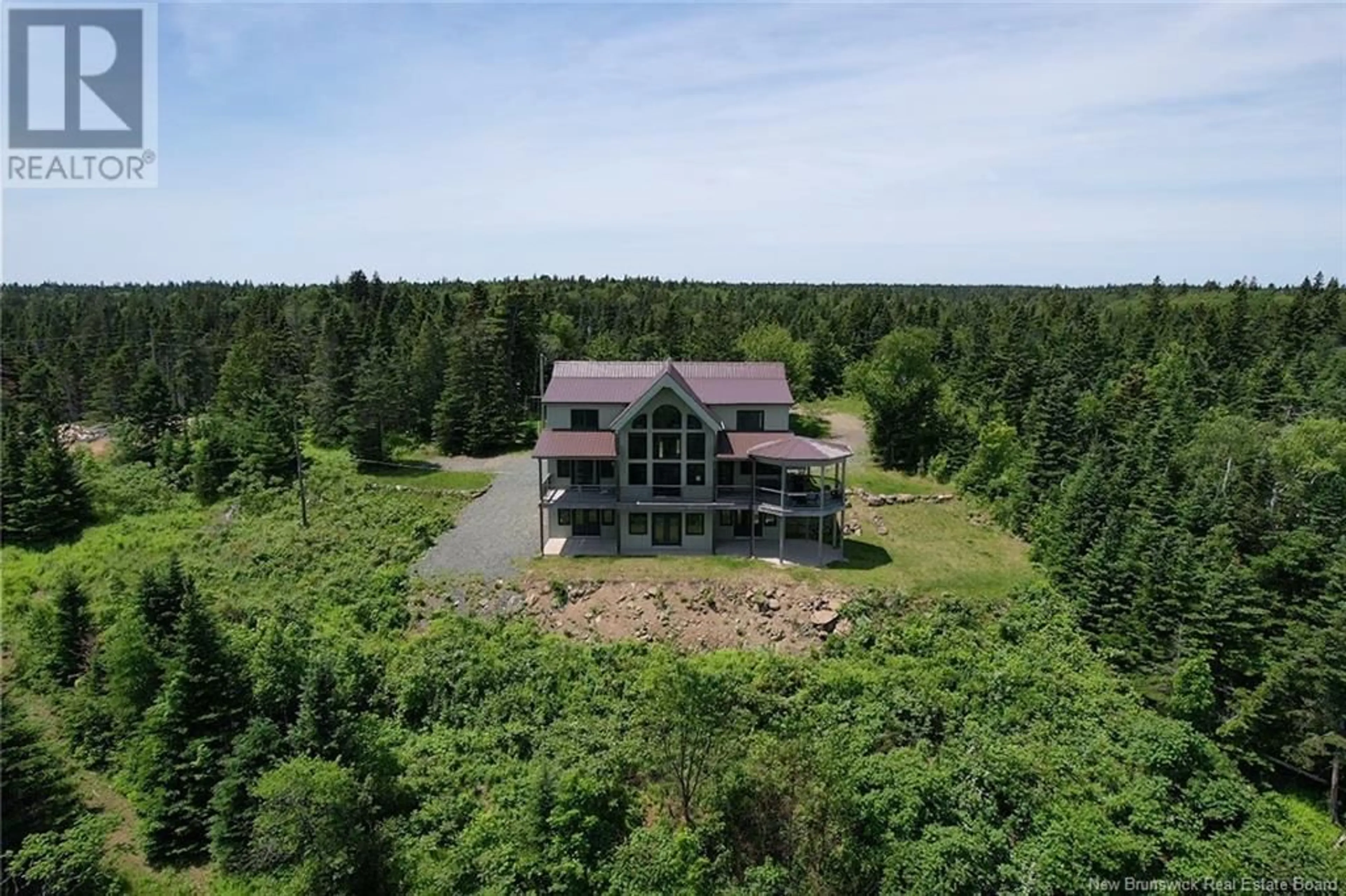 A pic from outside/outdoor area/front of a property/back of a property/a pic from drone, water/lake/river/ocean view for 60 OHIO POND ROAD, Grand Manan New Brunswick E5G4B4