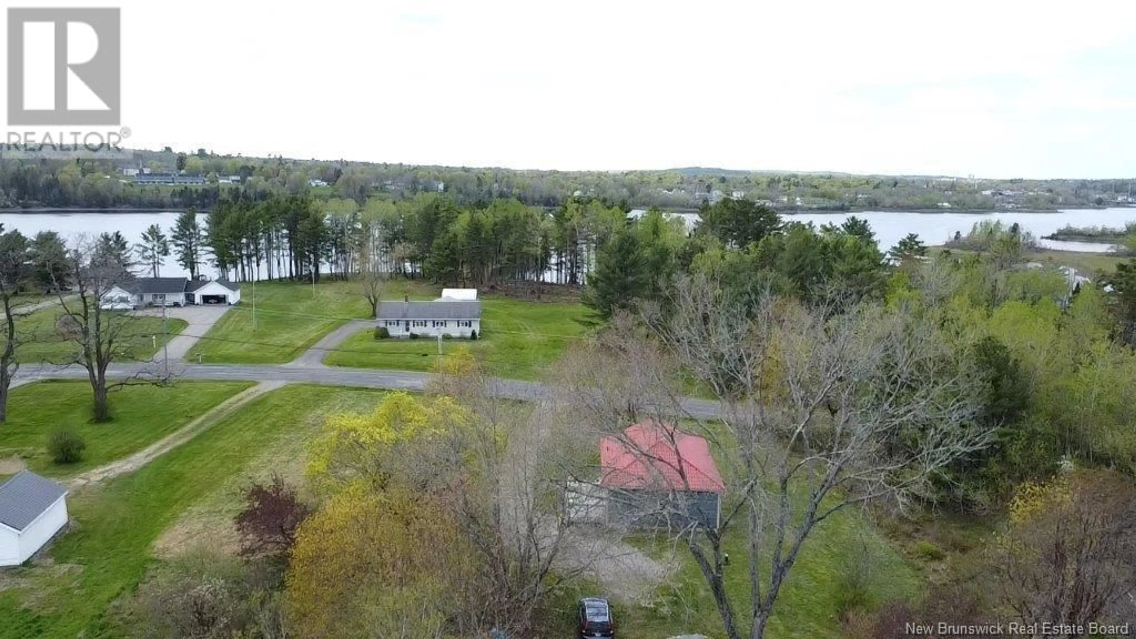 A pic from outside/outdoor area/front of a property/back of a property/a pic from drone, water/lake/river/ocean view for 204 LEDGE ROAD, Dufferin New Brunswick E3L3P2