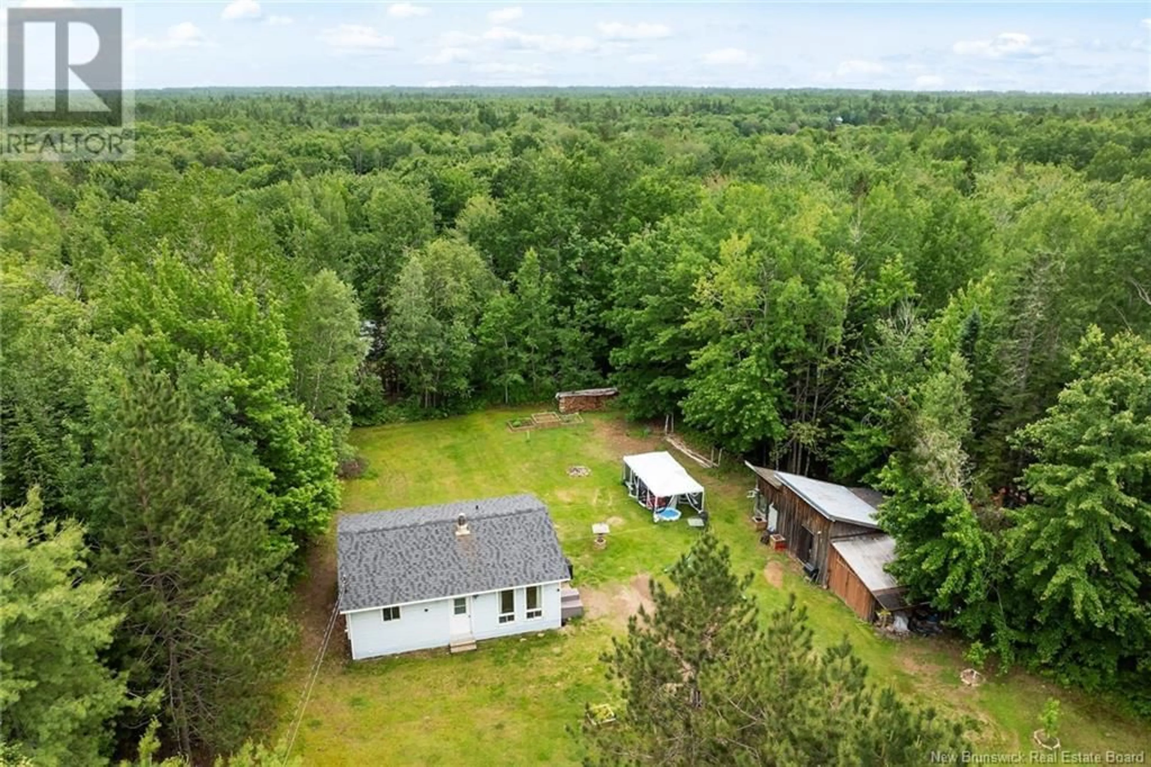 A pic from outside/outdoor area/front of a property/back of a property/a pic from drone, forest/trees view for 411 ROOTH ROAD, Vespra New Brunswick E5L1K8