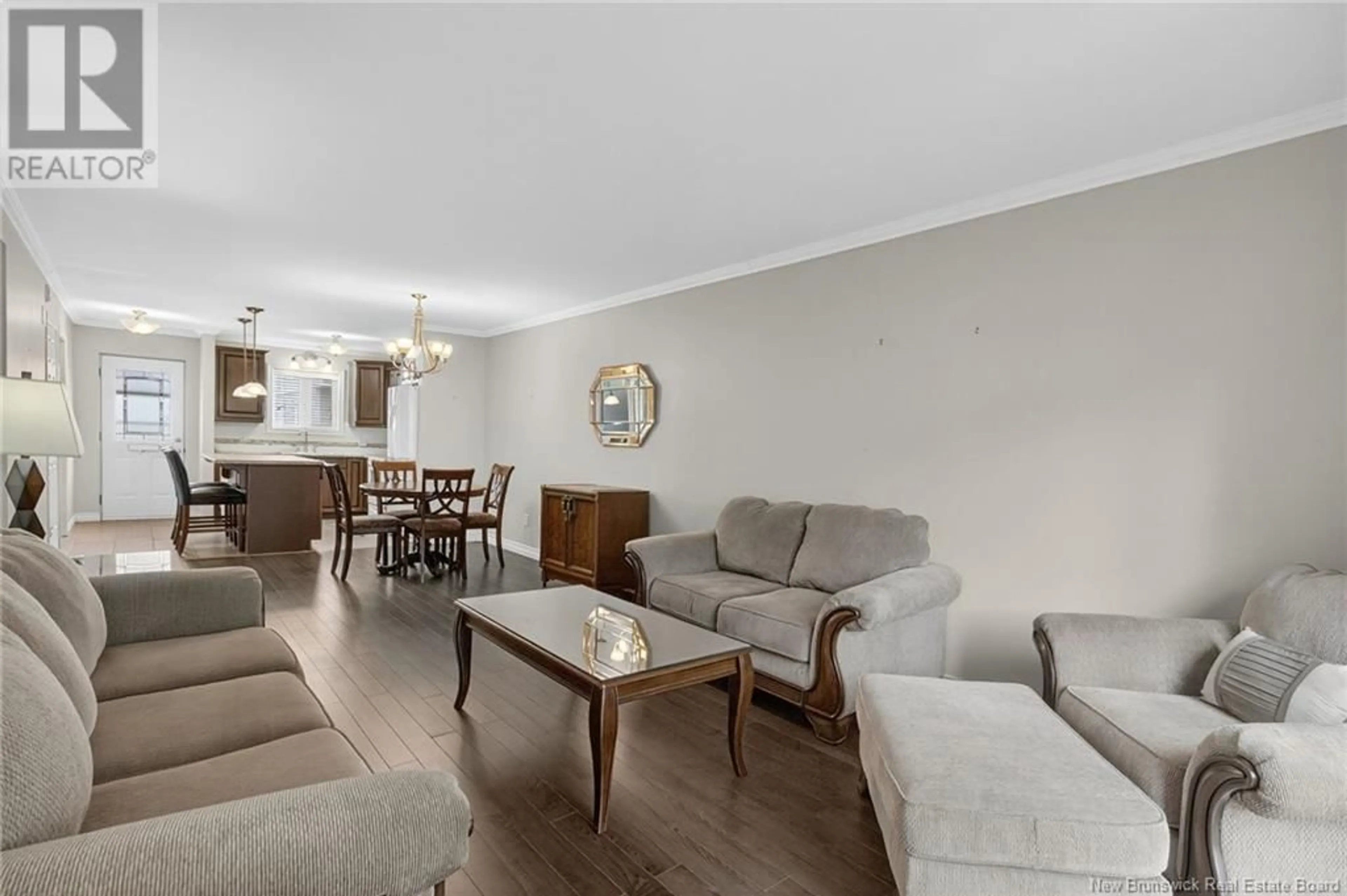 Living room with furniture, wood/laminate floor for 8 - 331 MCLAUGHLIN DRIVE, Moncton New Brunswick E1A4R3