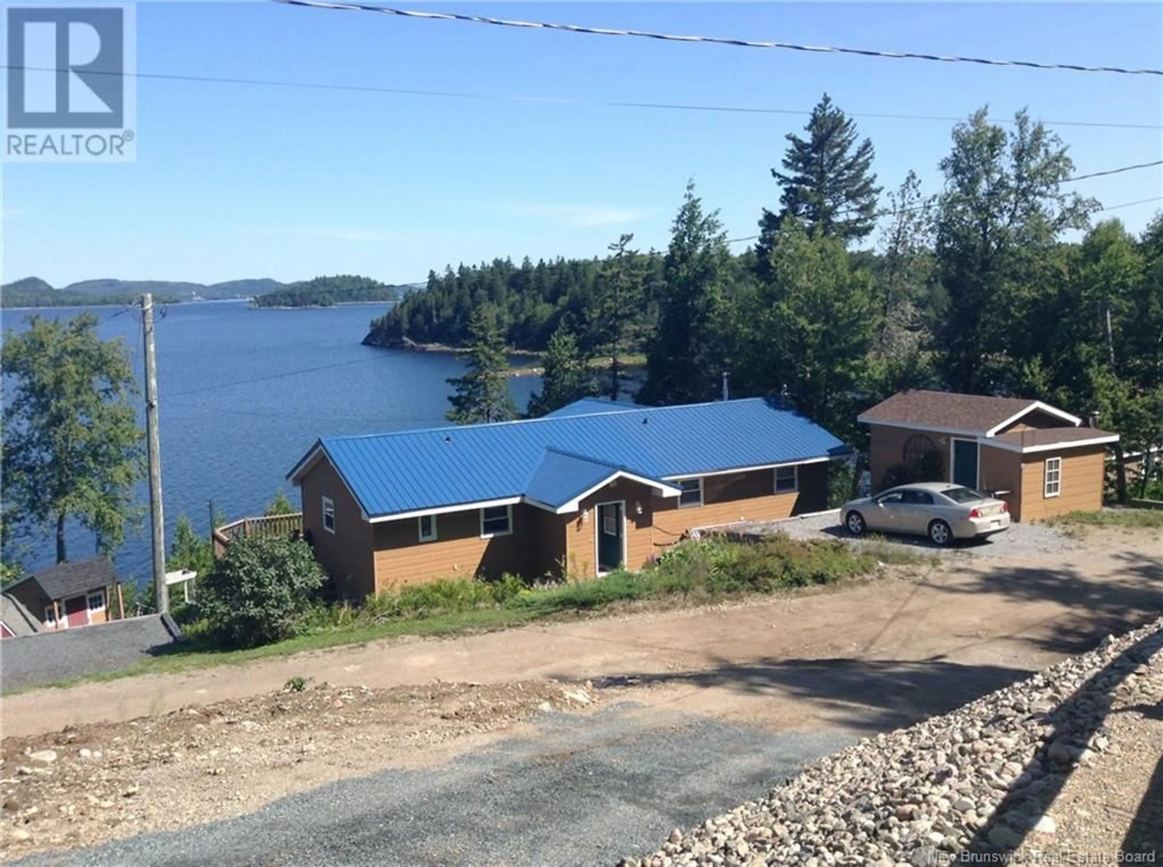 A pic from outside/outdoor area/front of a property/back of a property/a pic from drone, water/lake/river/ocean view for 28 EEL COVE, Utopia New Brunswick E5C2J4