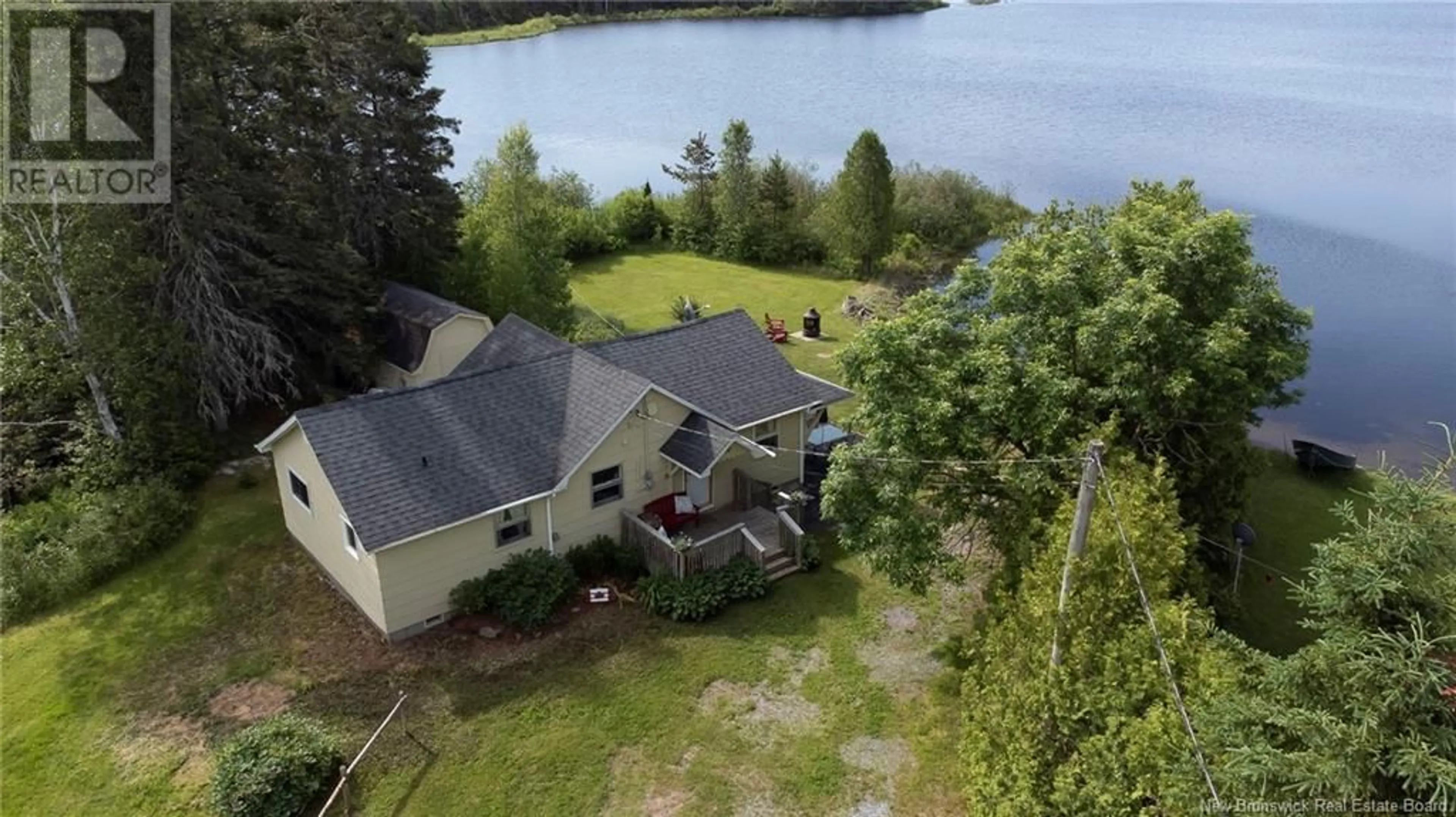 A pic from outside/outdoor area/front of a property/back of a property/a pic from drone, water/lake/river/ocean view for 128 LAKEFIELD ROAD, Cassidy Lake New Brunswick E4E5Y9